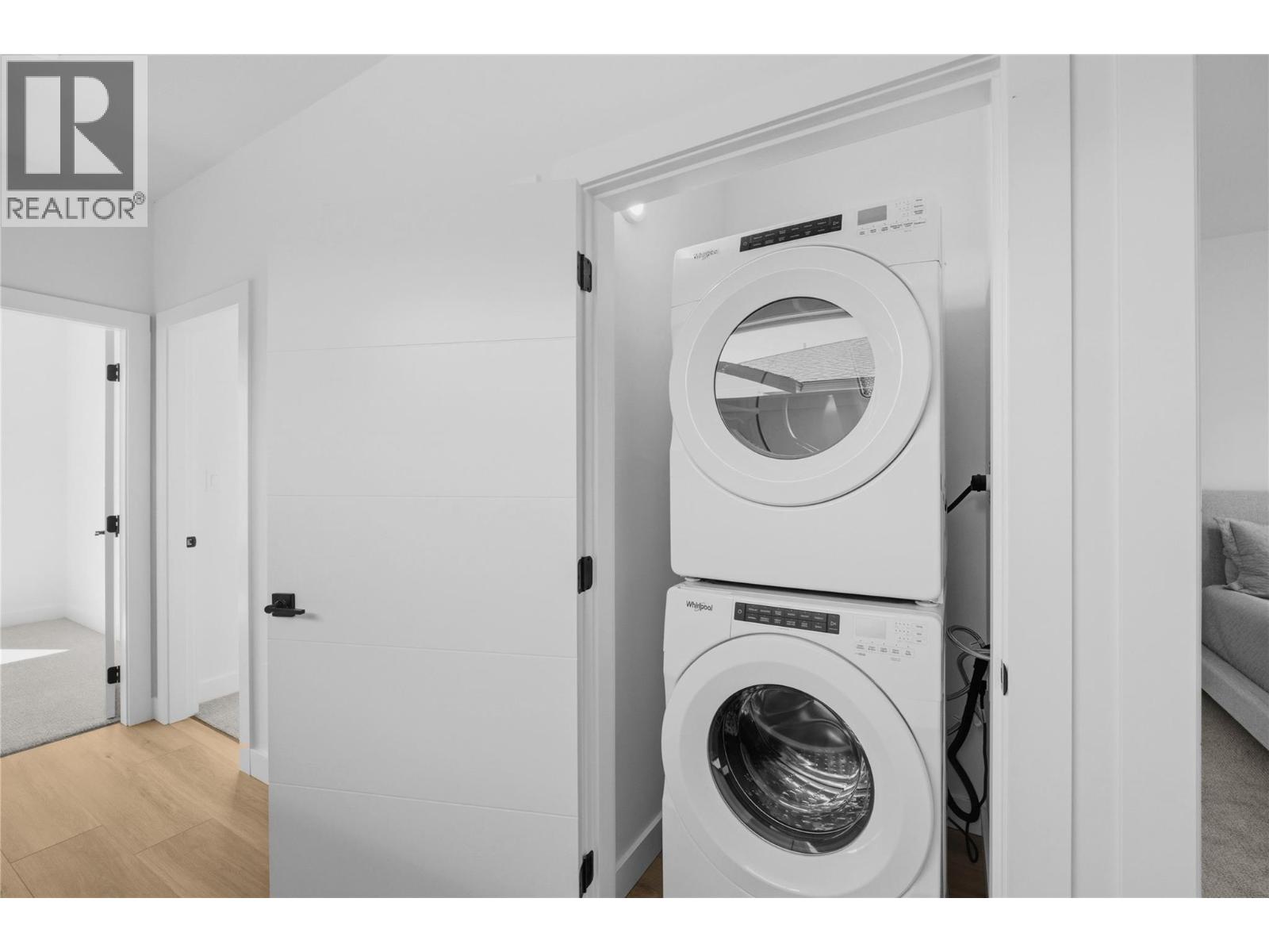 Representative listing media for Unit 101 at 143 Green Avenue, Penticton — upper-level laundry