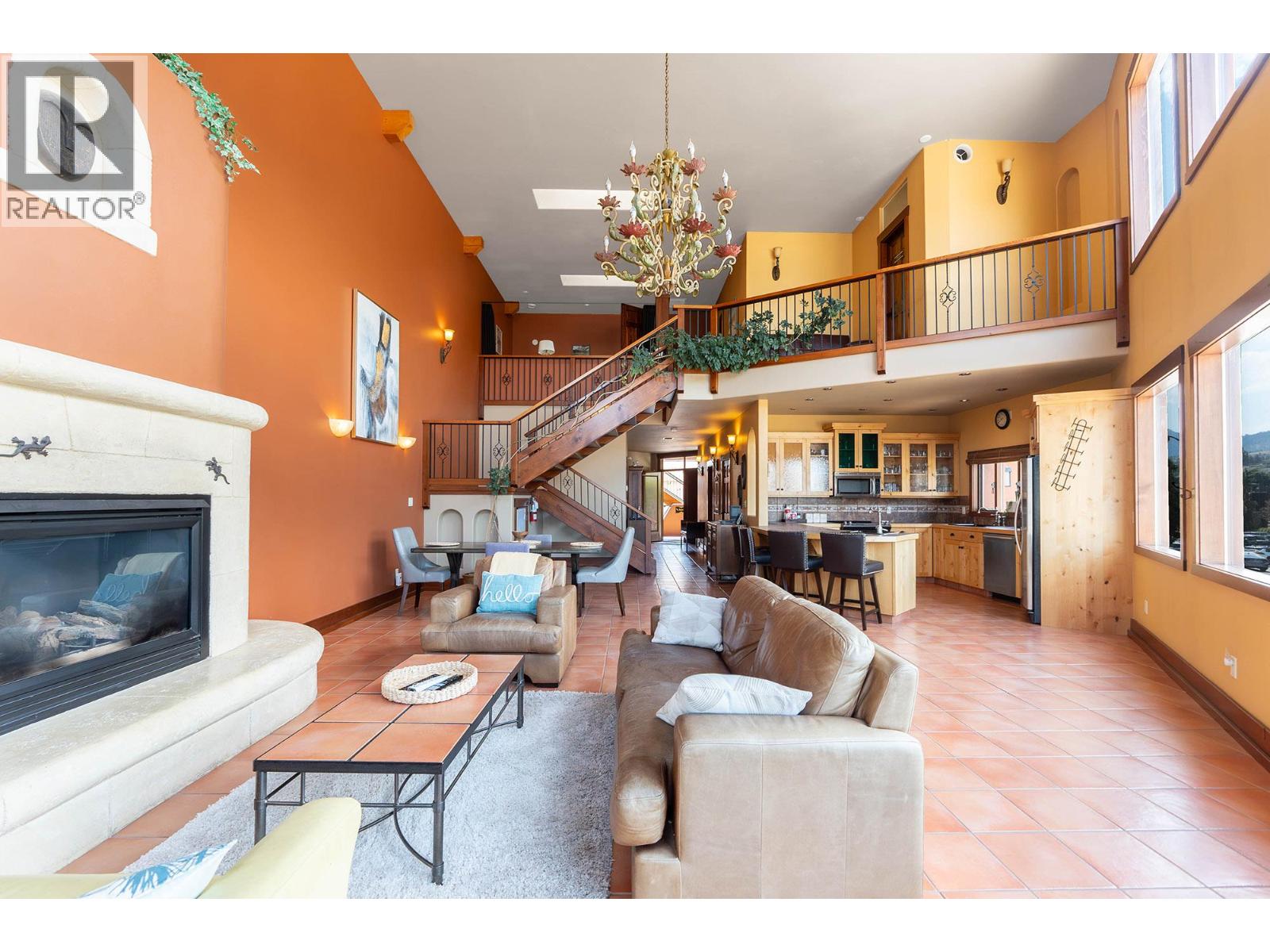 Unit 201 at Casa Grande Inn & Suites, 1070 Lakeshore Drive W, Penticton — double-height living room