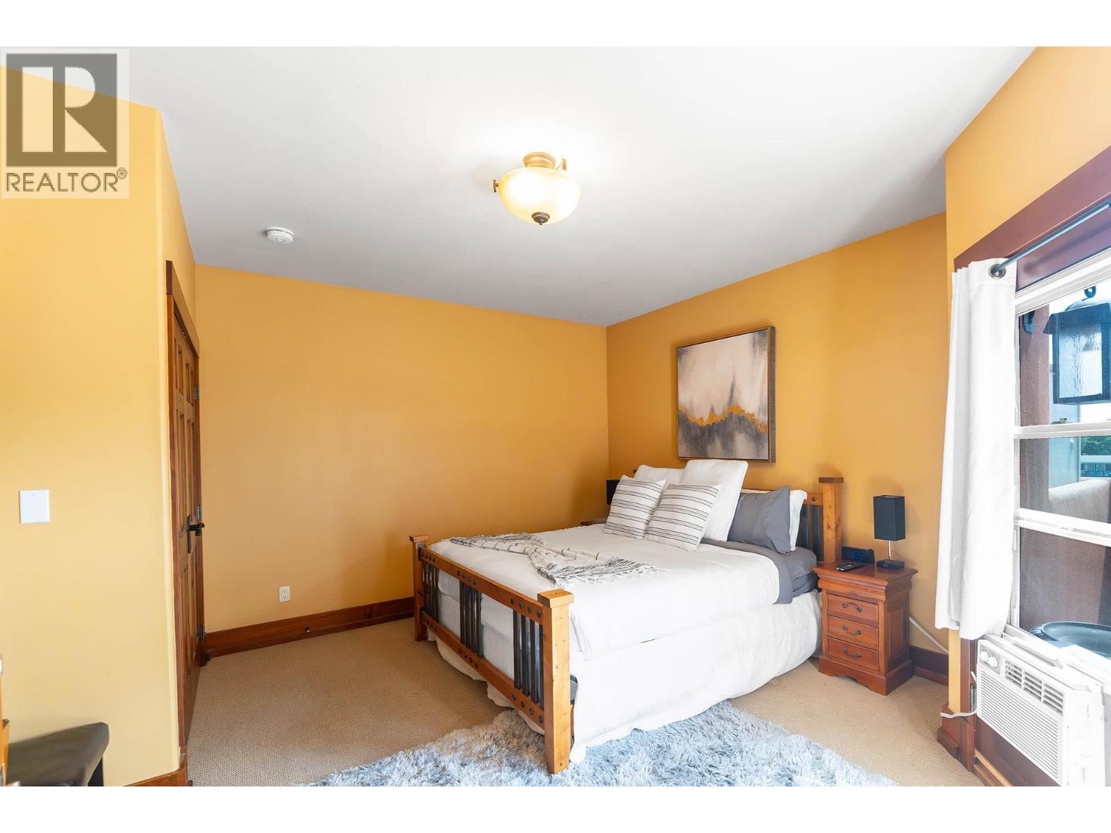 Unit 201 at Casa Grande Inn & Suites, 1070 Lakeshore Drive W, Penticton — bedroom in the lock-off suite