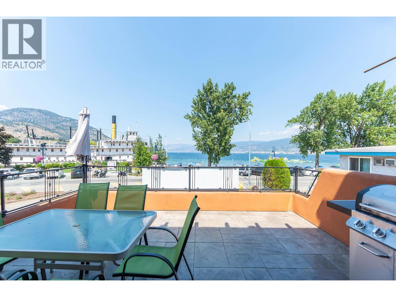 Unit 202 at Casa Grande Inn & Suites, 1070 Lakeshore Drive W, Penticton — patio with Okanagan Lake view