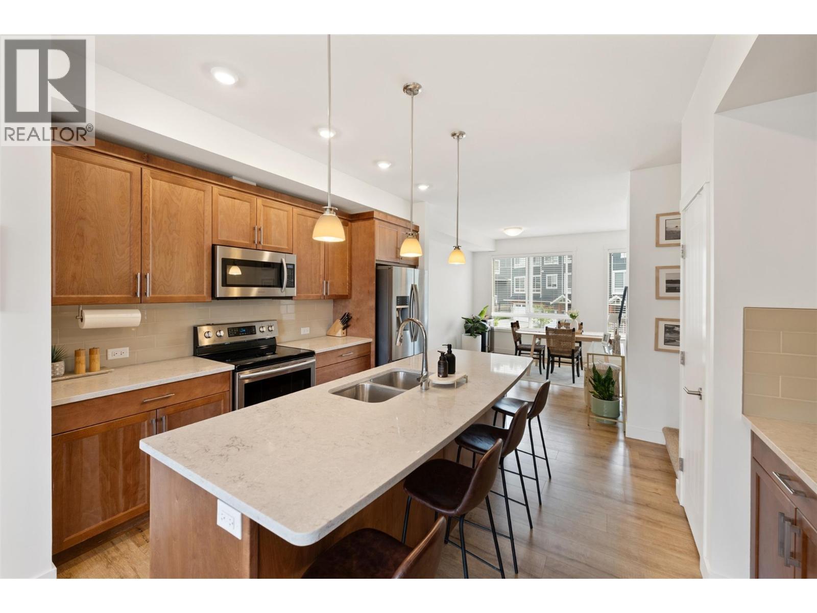 Unit 118 at Sendero Gate, 1115 Holden Road, Penticton — kitchen with island