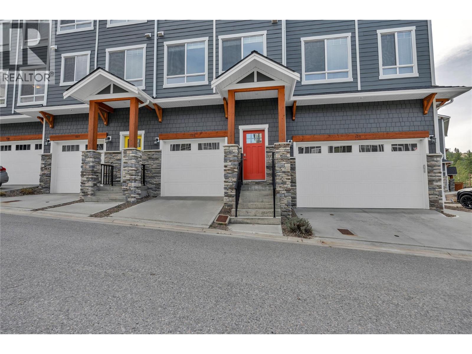 Unit 126 at Sendero Gate, 1115 Holden Road, Penticton — front exterior and attached garage