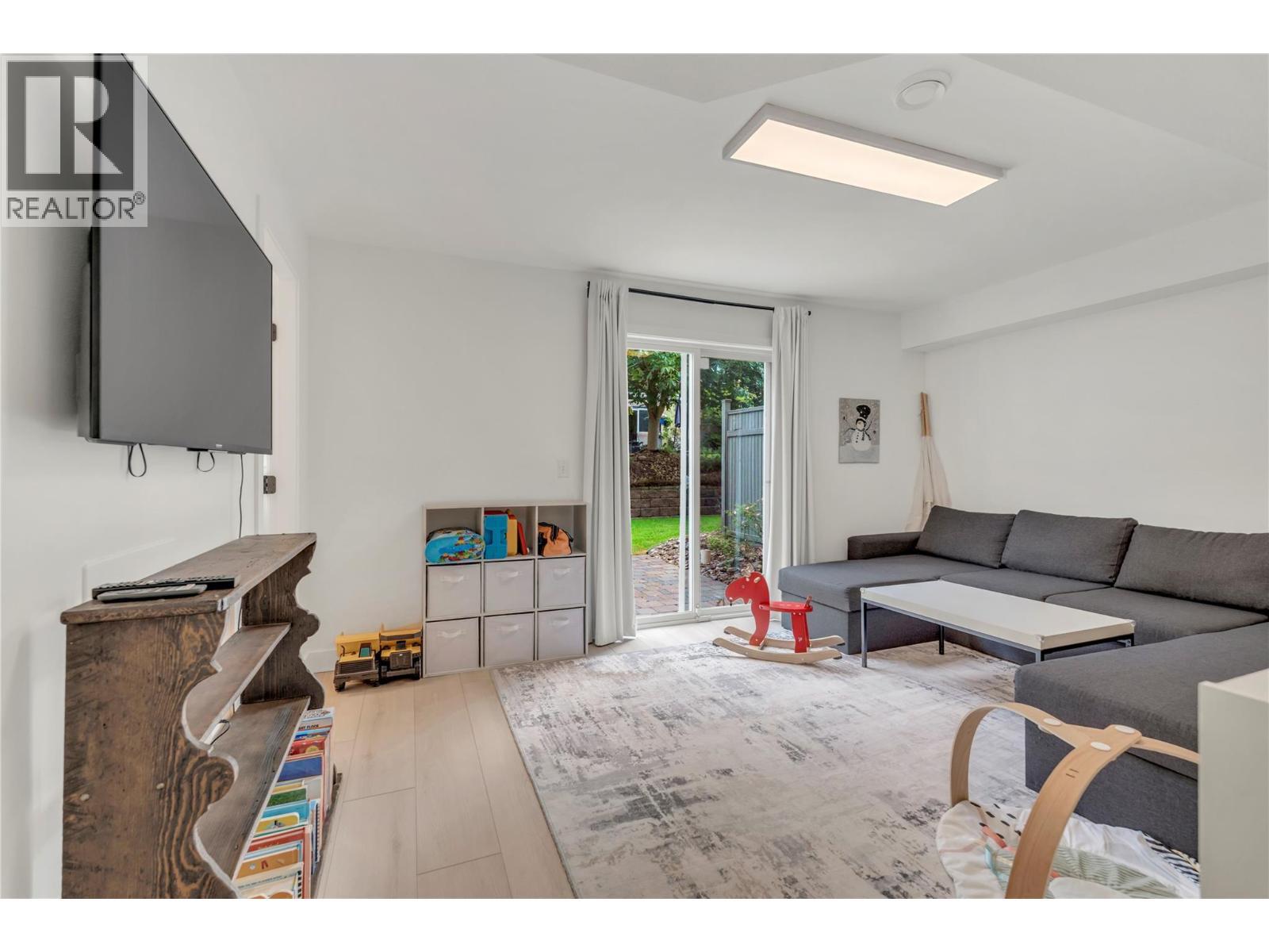 Unit 116 at Somerset Court, 48 Galt Avenue, Penticton — ground-level flex room