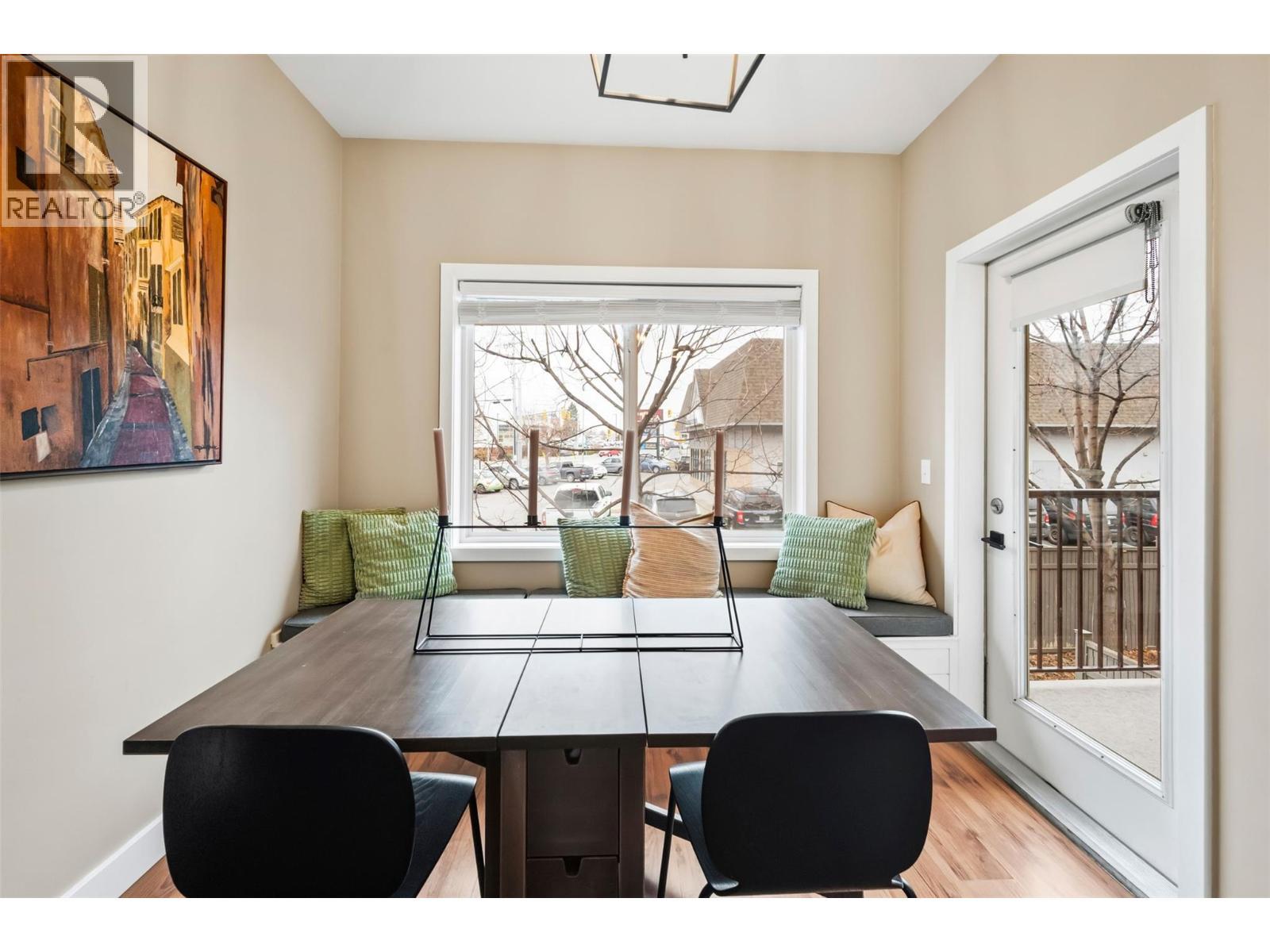 Unit 127 at Somerset Court, 48 Galt Avenue, Penticton — dining area and balcony access