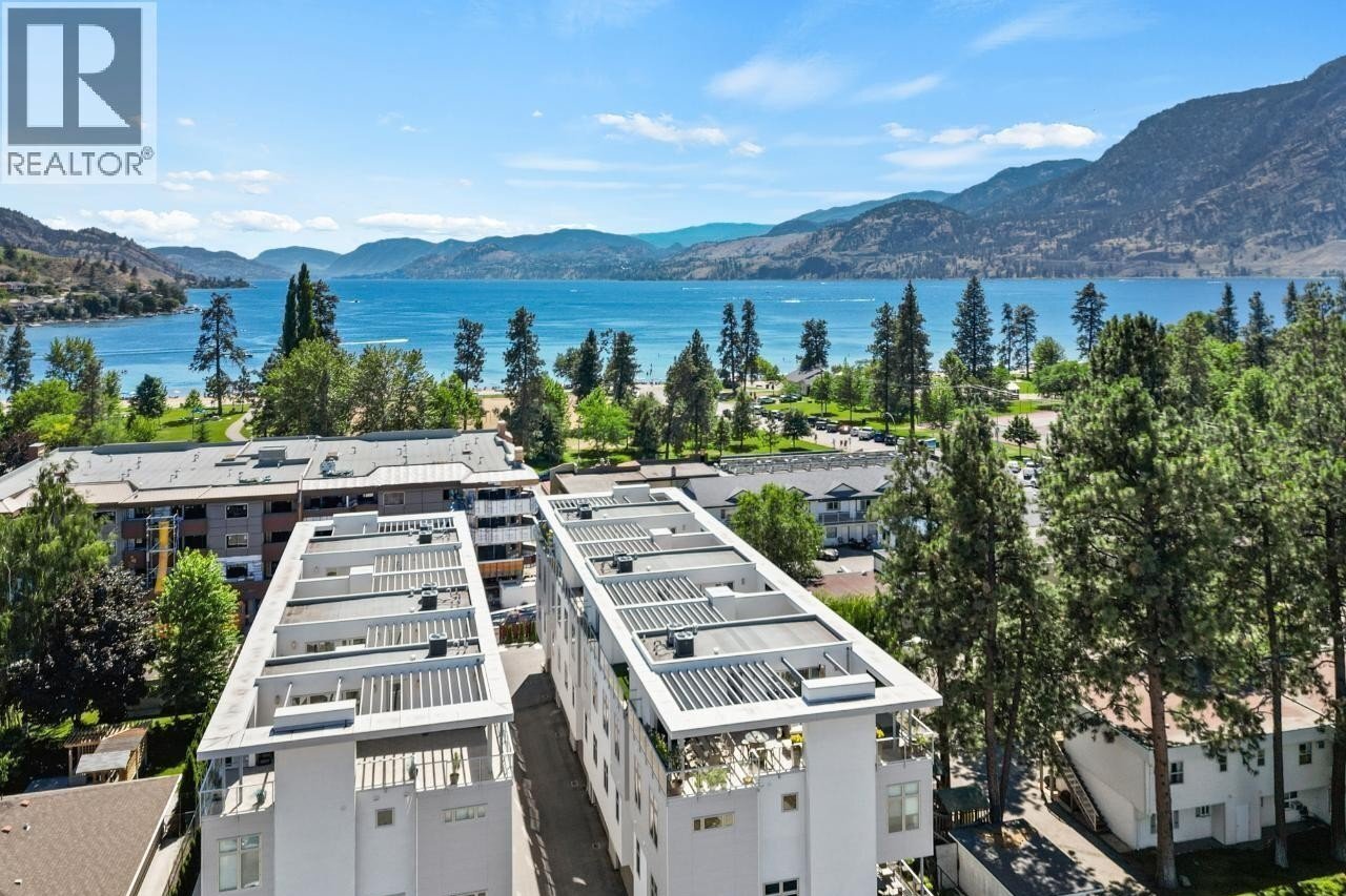 Unit 102 at The Artisan on Lee, 222 Lee Avenue, Penticton — aerial lake and neighbourhood view