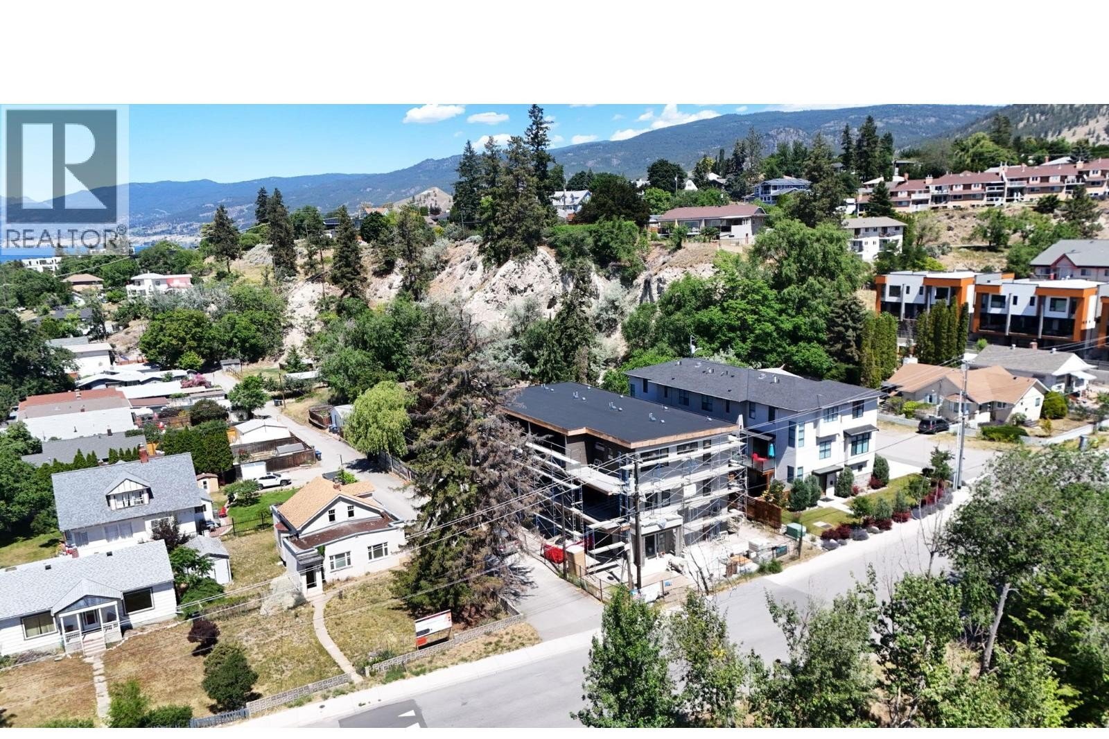Unit 102 at The Wade Residences, 463 Wade Avenue, Penticton — aerial neighbourhood and construction view