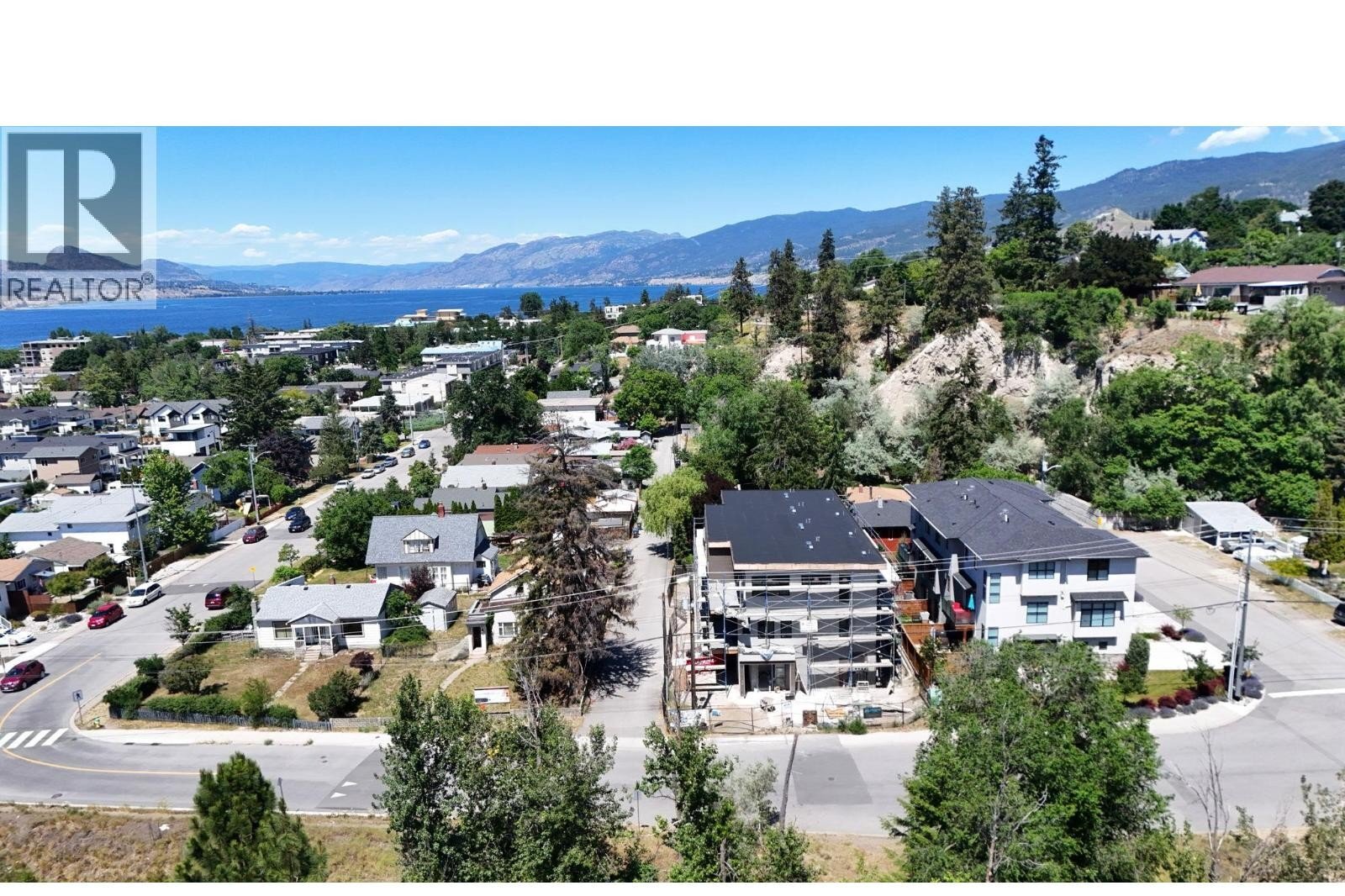 Unit 102 at The Wade Residences, 463 Wade Avenue, Penticton — aerial neighbourhood and construction view