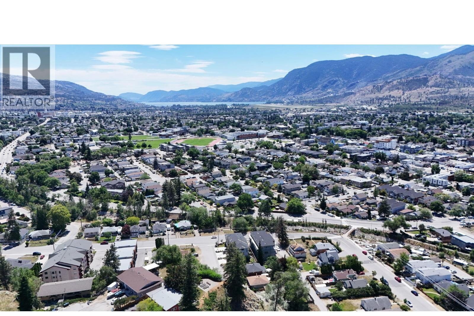 Unit 102 at The Wade Residences, 463 Wade Avenue, Penticton — aerial neighbourhood and construction view