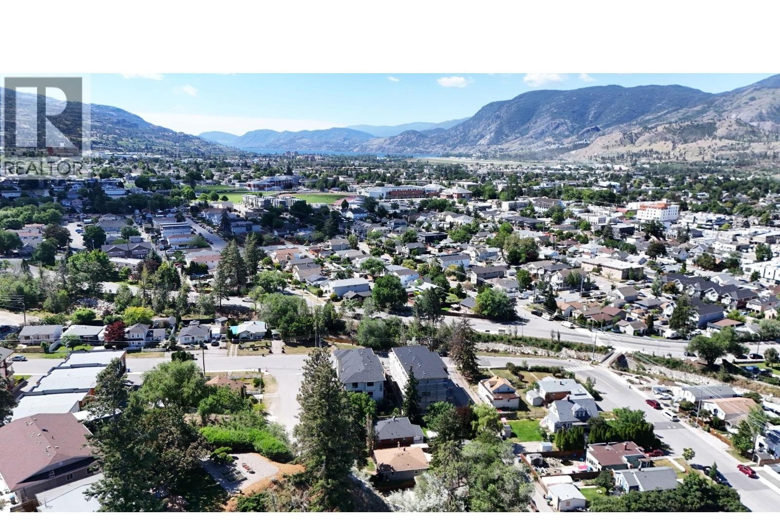 Unit 102 at The Wade Residences, 463 Wade Avenue, Penticton — aerial neighbourhood and construction view