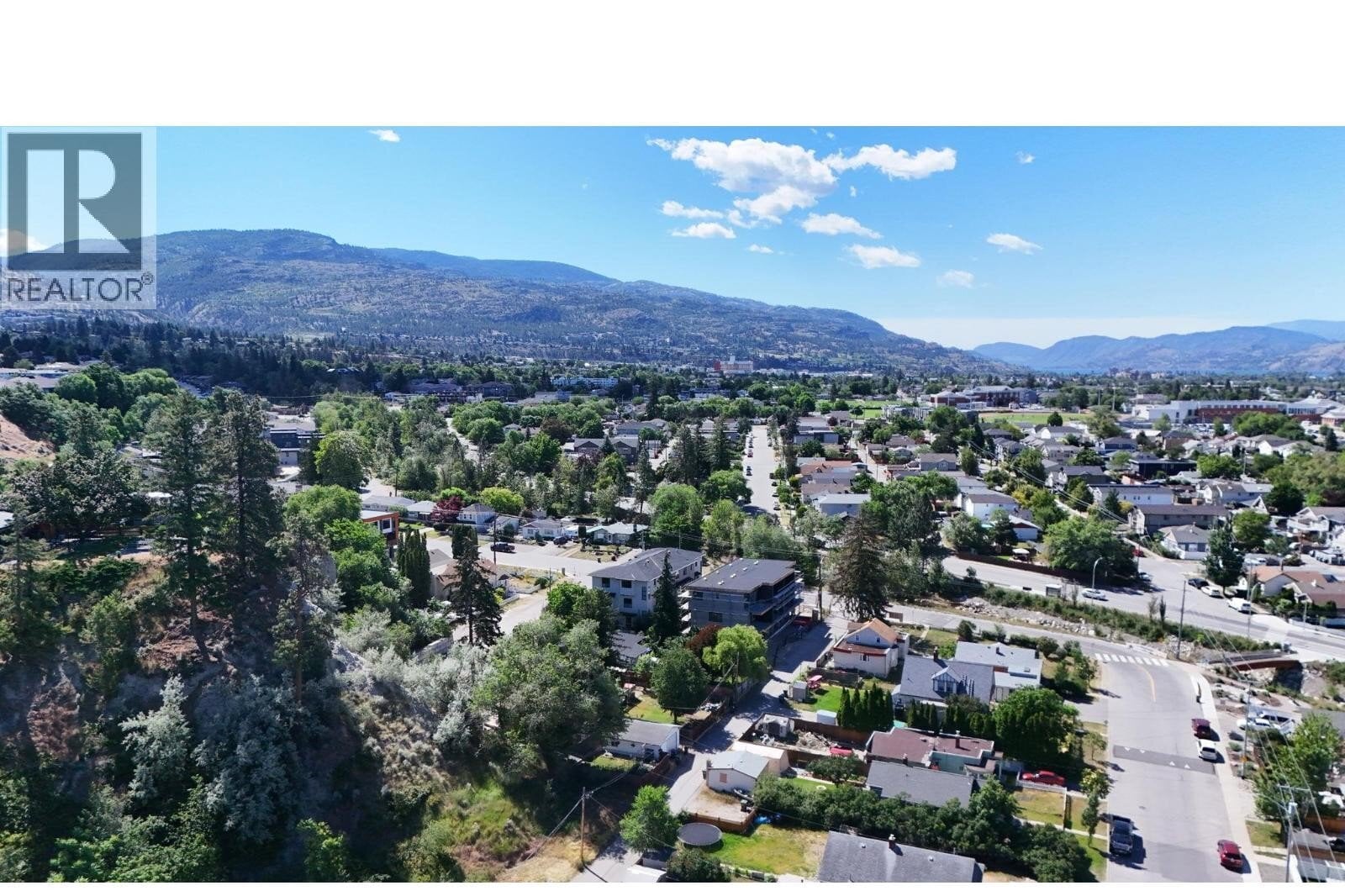 Unit 102 at The Wade Residences, 463 Wade Avenue, Penticton — aerial neighbourhood and construction view