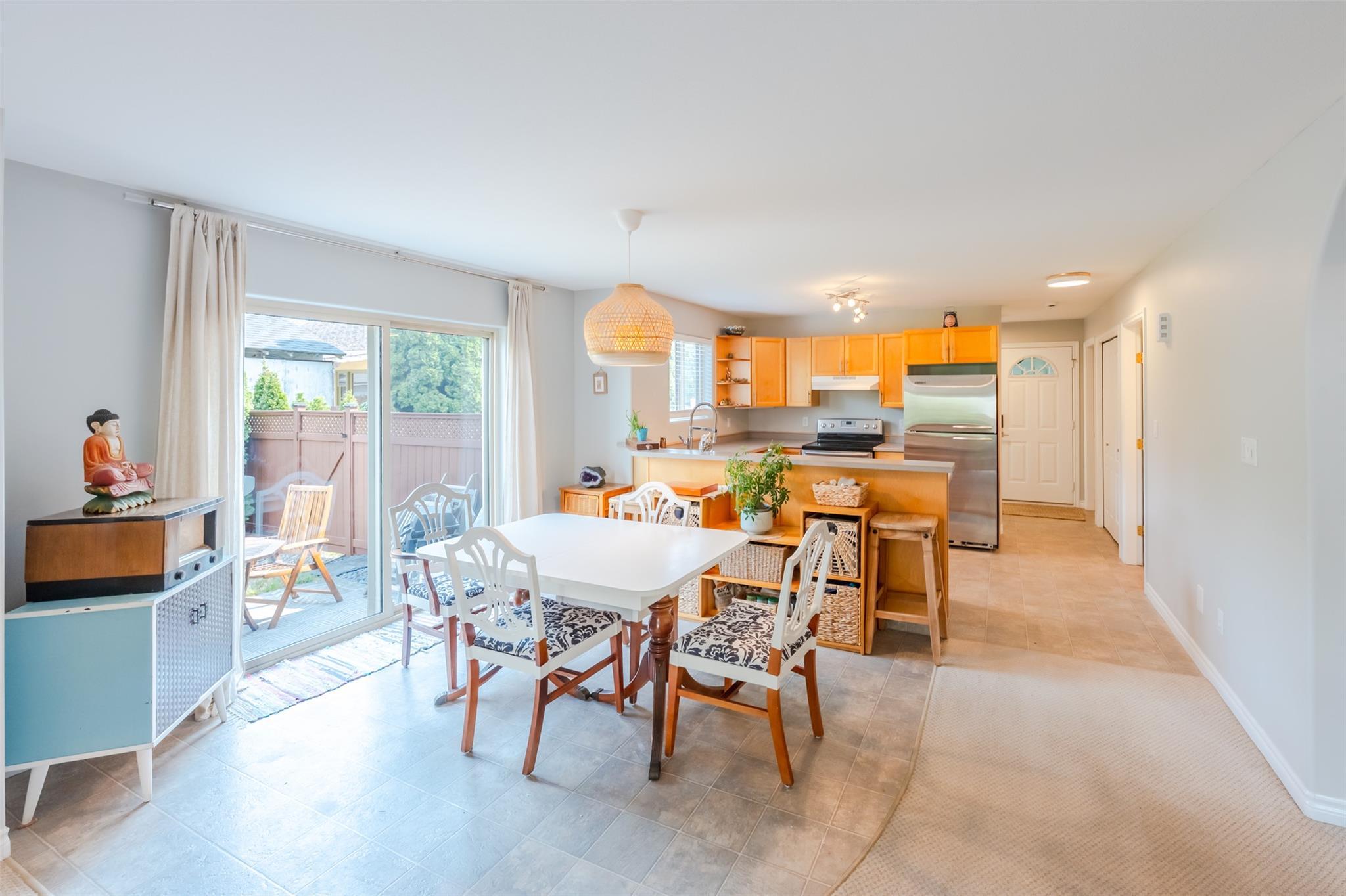 Dining area and open-concept kitchen in Unit 101.