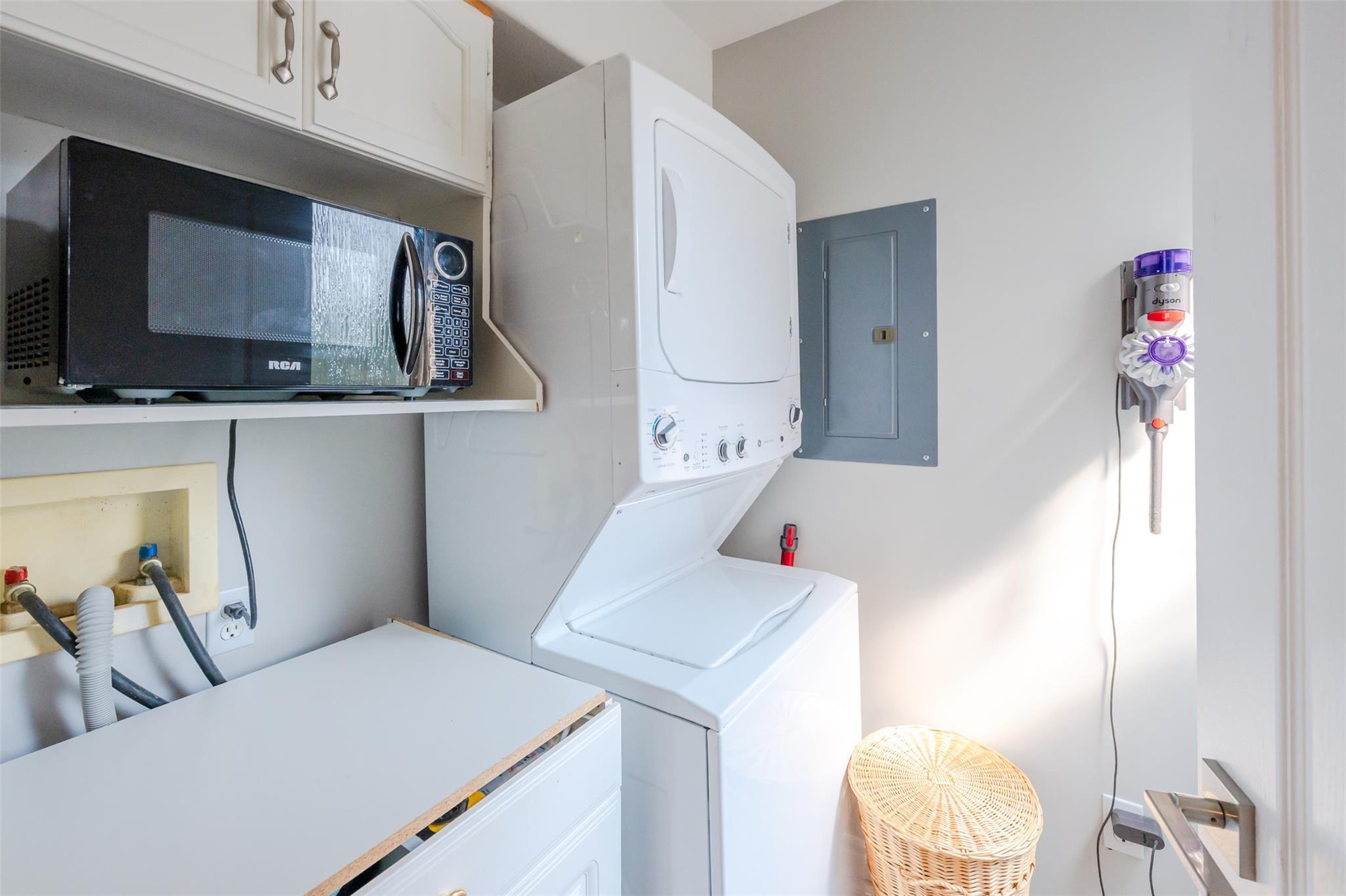 In-unit laundry and utility area in Unit 101.