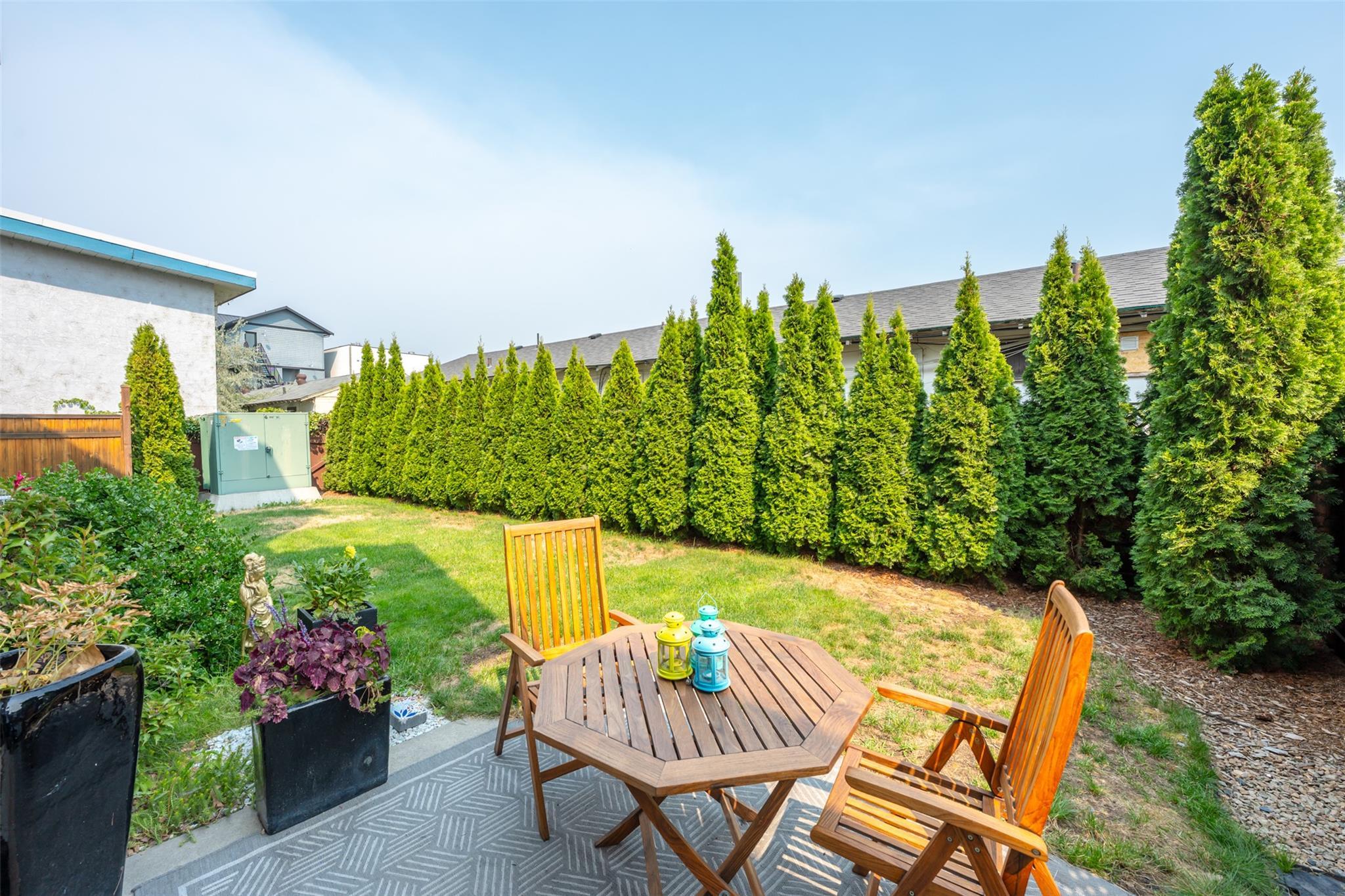 Private patio and fenced backyard at Unit 101.