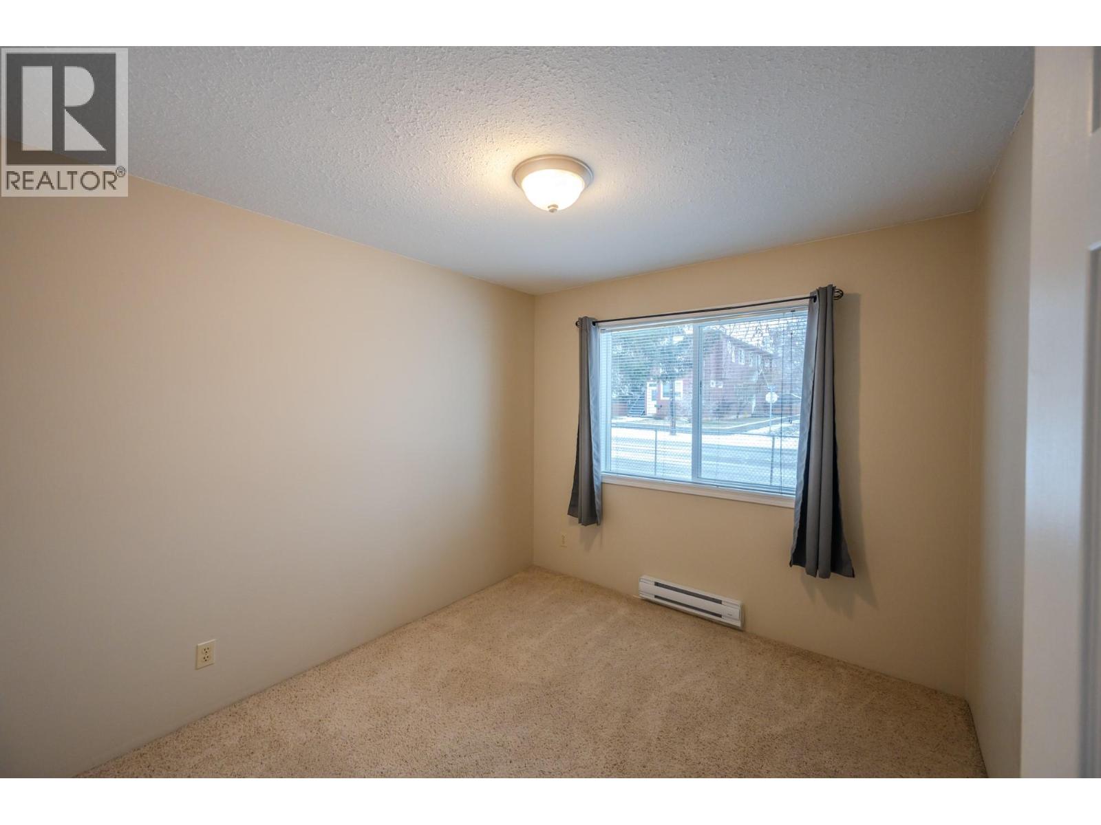 Second bedroom in Unit 101 at 601 Wade Avenue W, Penticton