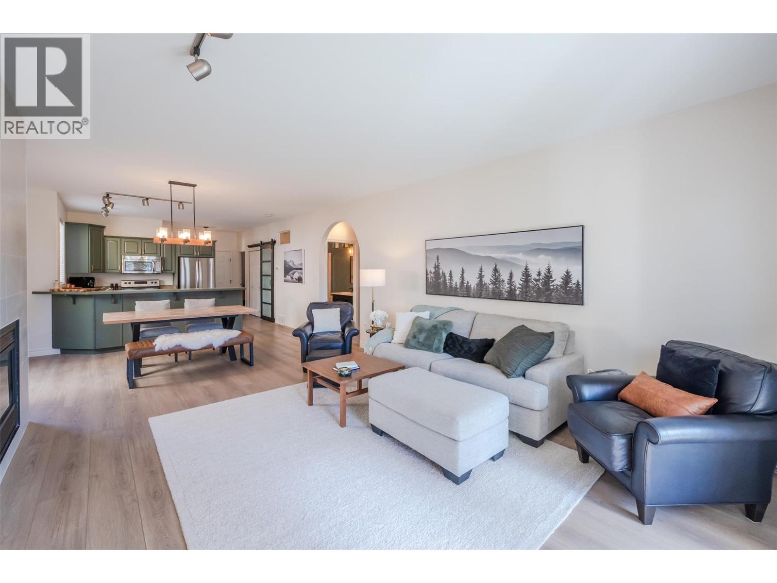 Bright open-concept living room in Unit 102.