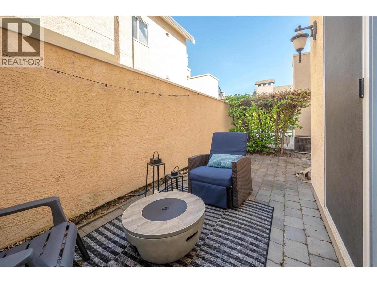 Private ground-level patio at Unit 102.