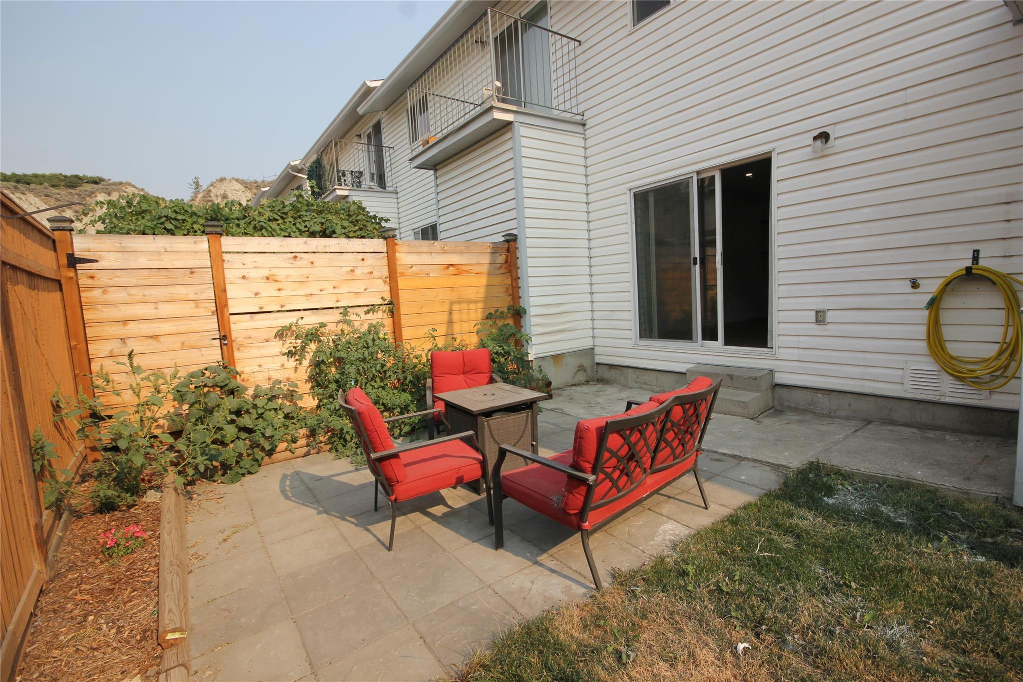 Fenced private patio and yard at Unit 104.