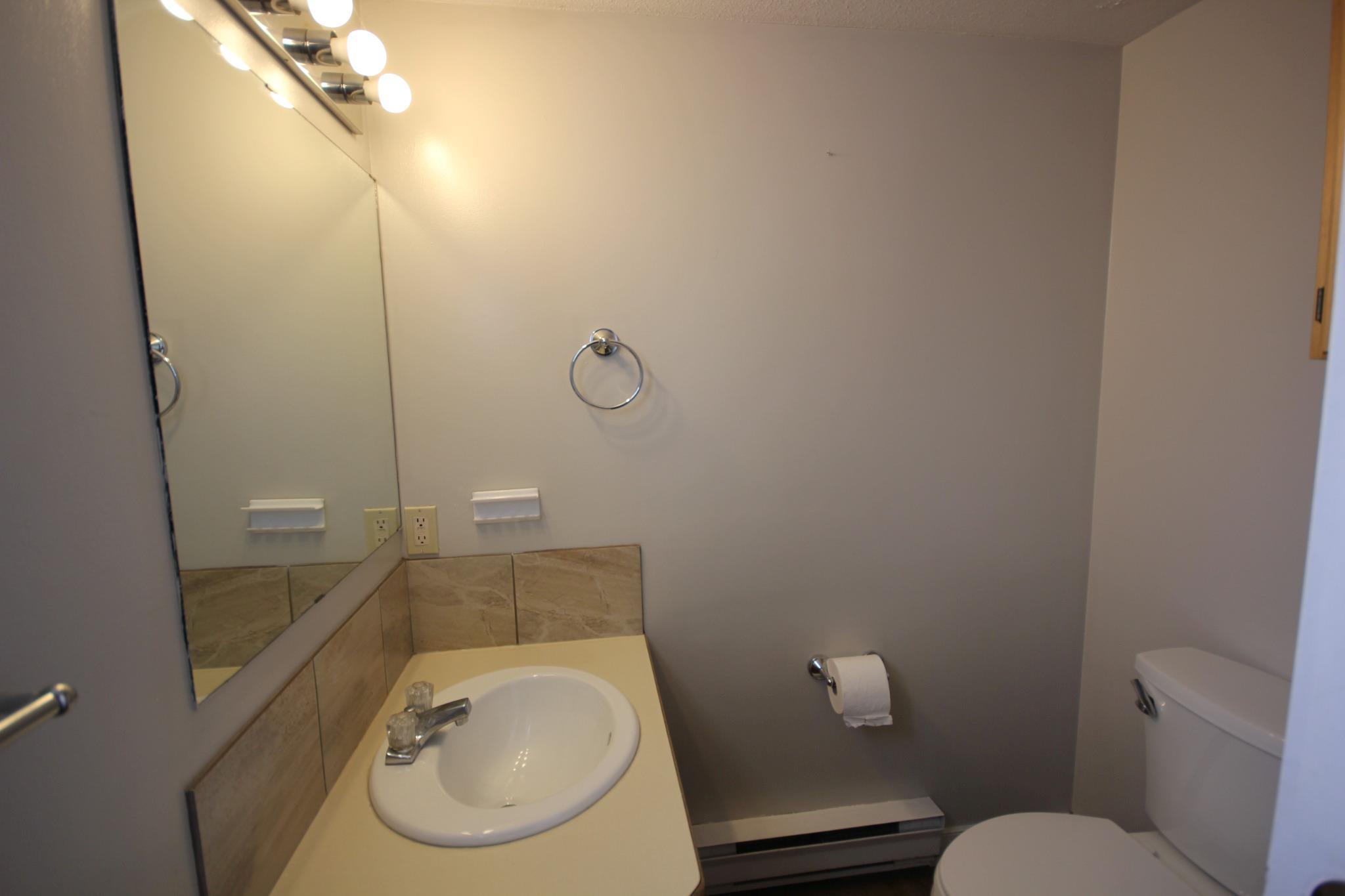 Main-floor powder room in Unit 104.