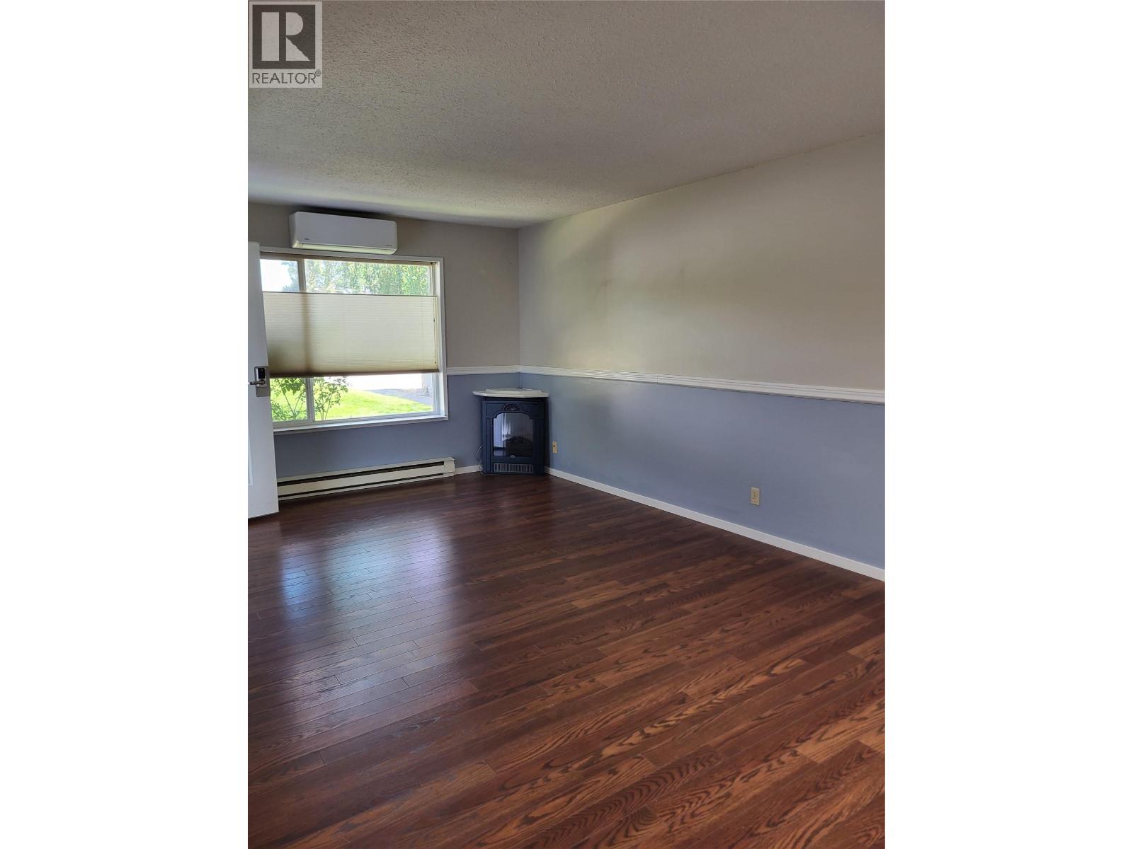 Living room in Unit 105 at 601 Wade Avenue W, Penticton