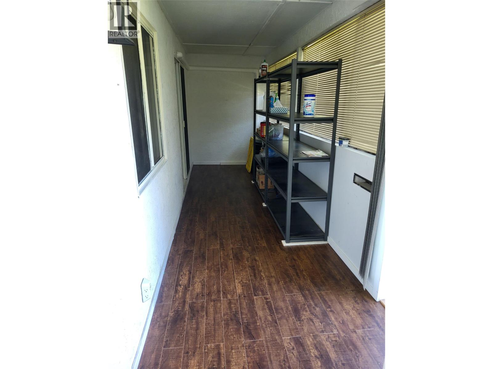 Enclosed deck used for storage at Unit 105, 601 Wade Avenue W, Penticton