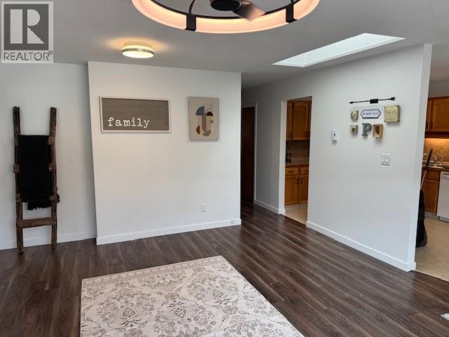 Open living and dining area leading toward the kitchen in Unit 108.
