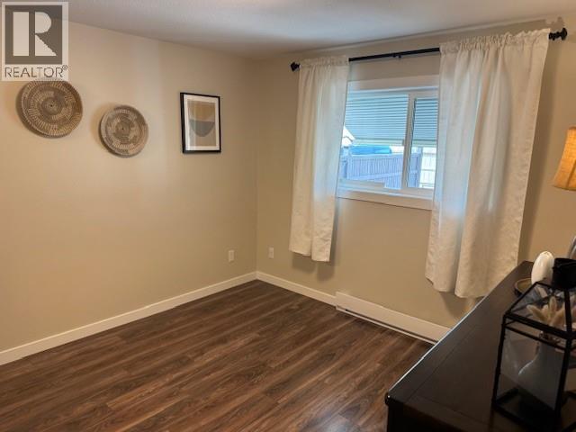 Primary bedroom with window in Unit 108 at Wilson Gardens.
