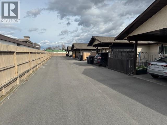 Shared complex lane and covered parking context at 3065 Wilson Street.