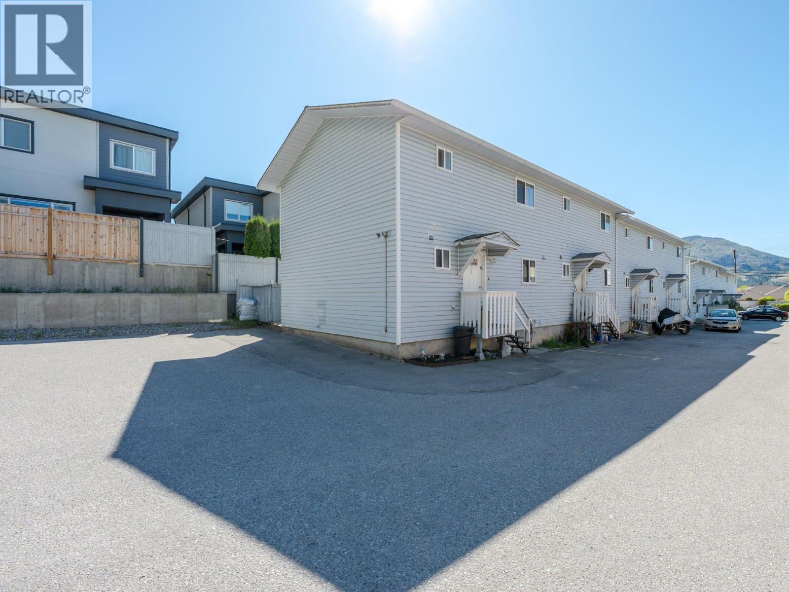 108 3372 South Main Street, Penticton — exterior of the Royal Place townhome building