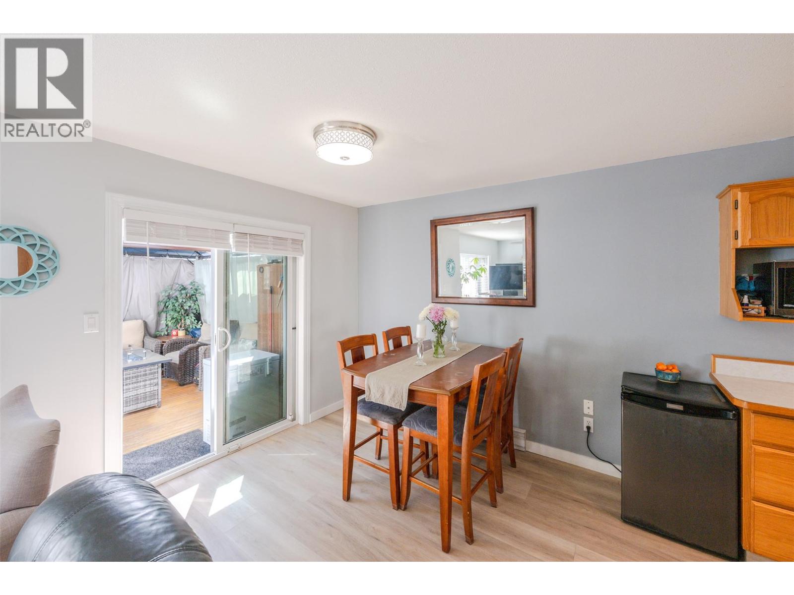 108 3372 South Main Street, Penticton — dining area with patio access