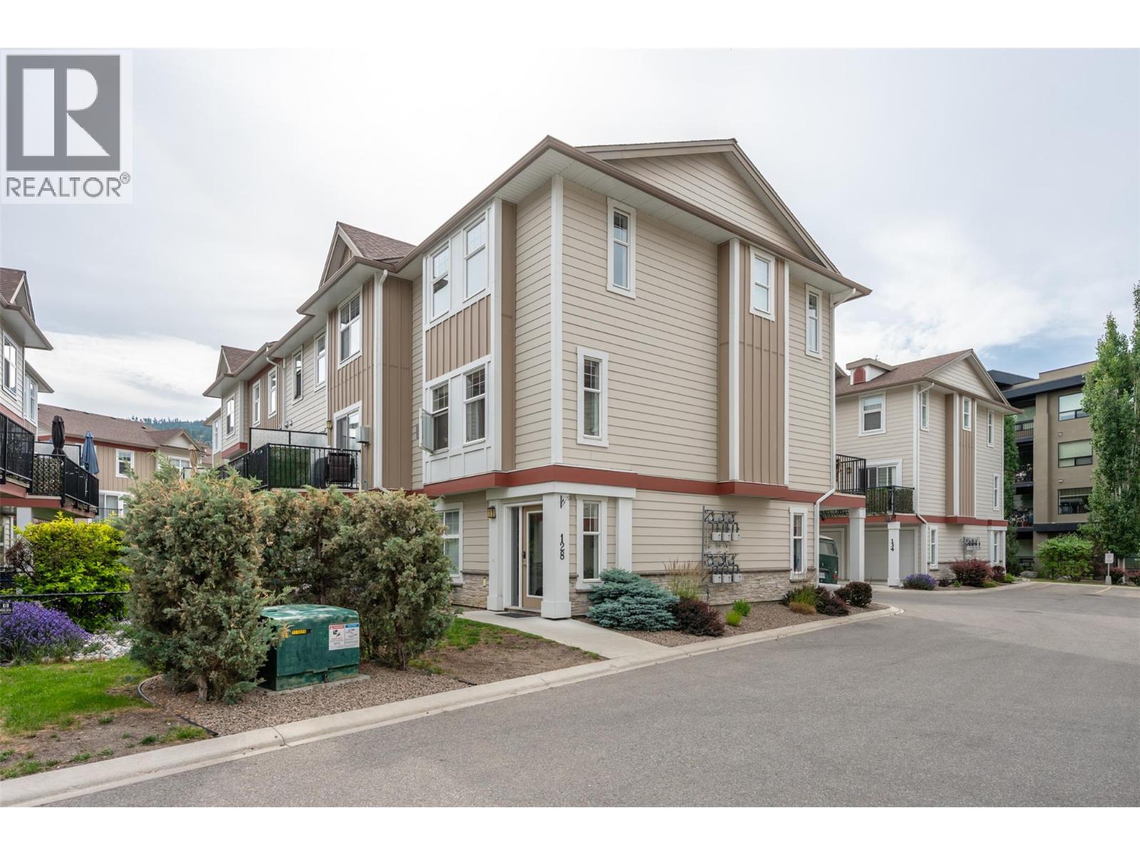 128 3363 Wilson Street, Penticton — front exterior of the end-unit townhome