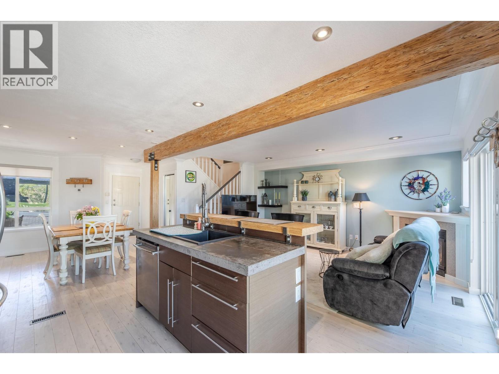 132 3948 Finnerty Road, Penticton — open kitchen, dining and living area