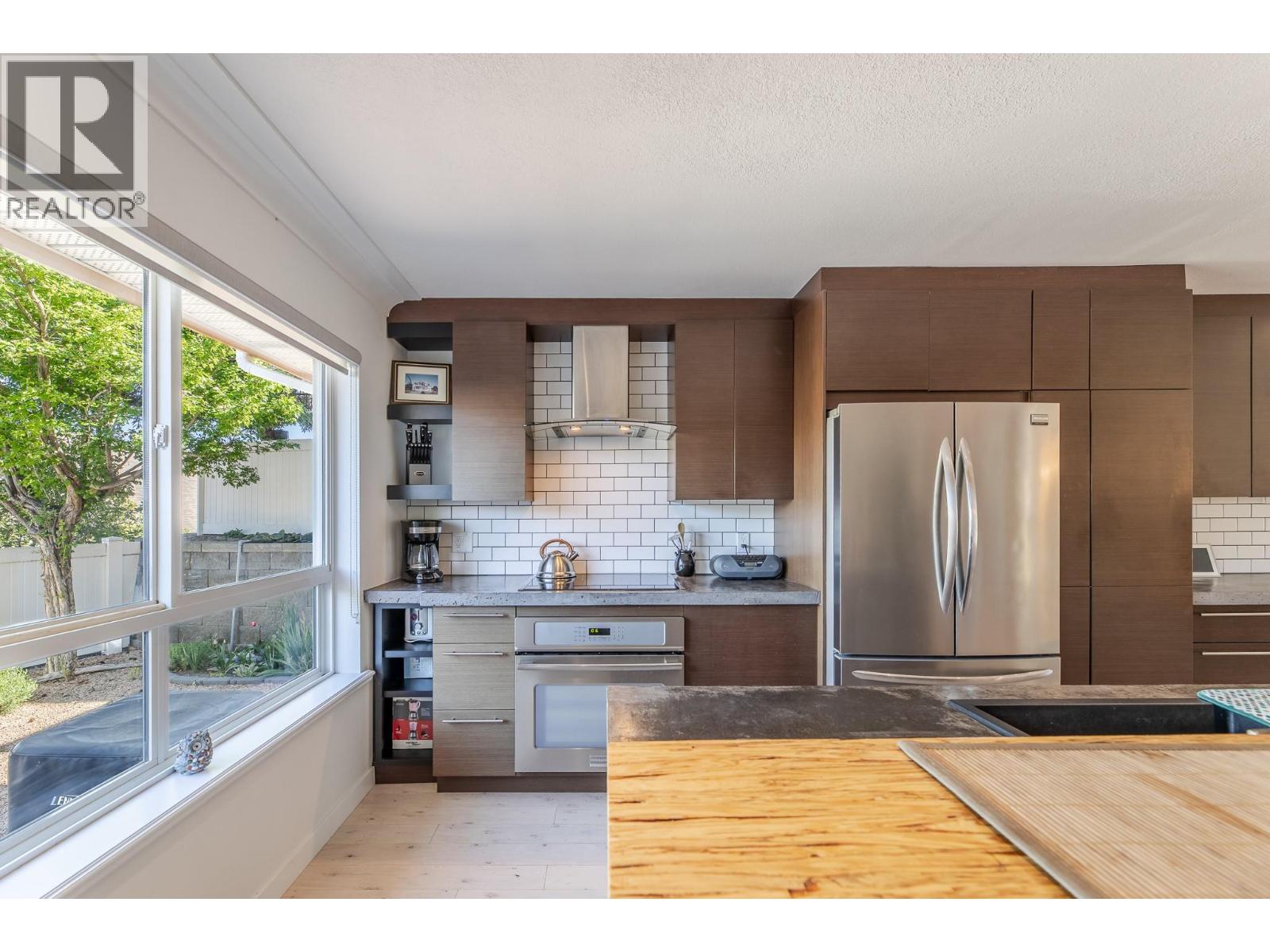 132 3948 Finnerty Road, Penticton — renovated kitchen cabinetry and appliances