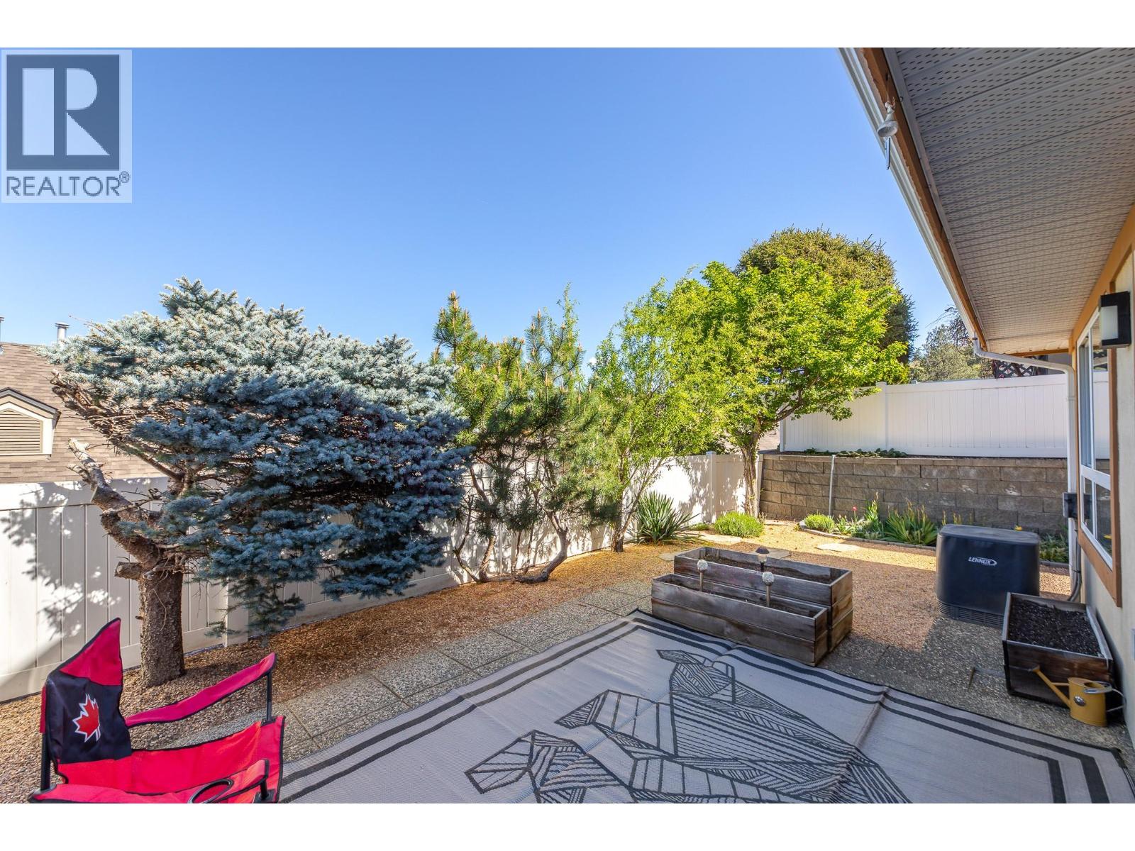132 3948 Finnerty Road, Penticton — fenced private patio and yard