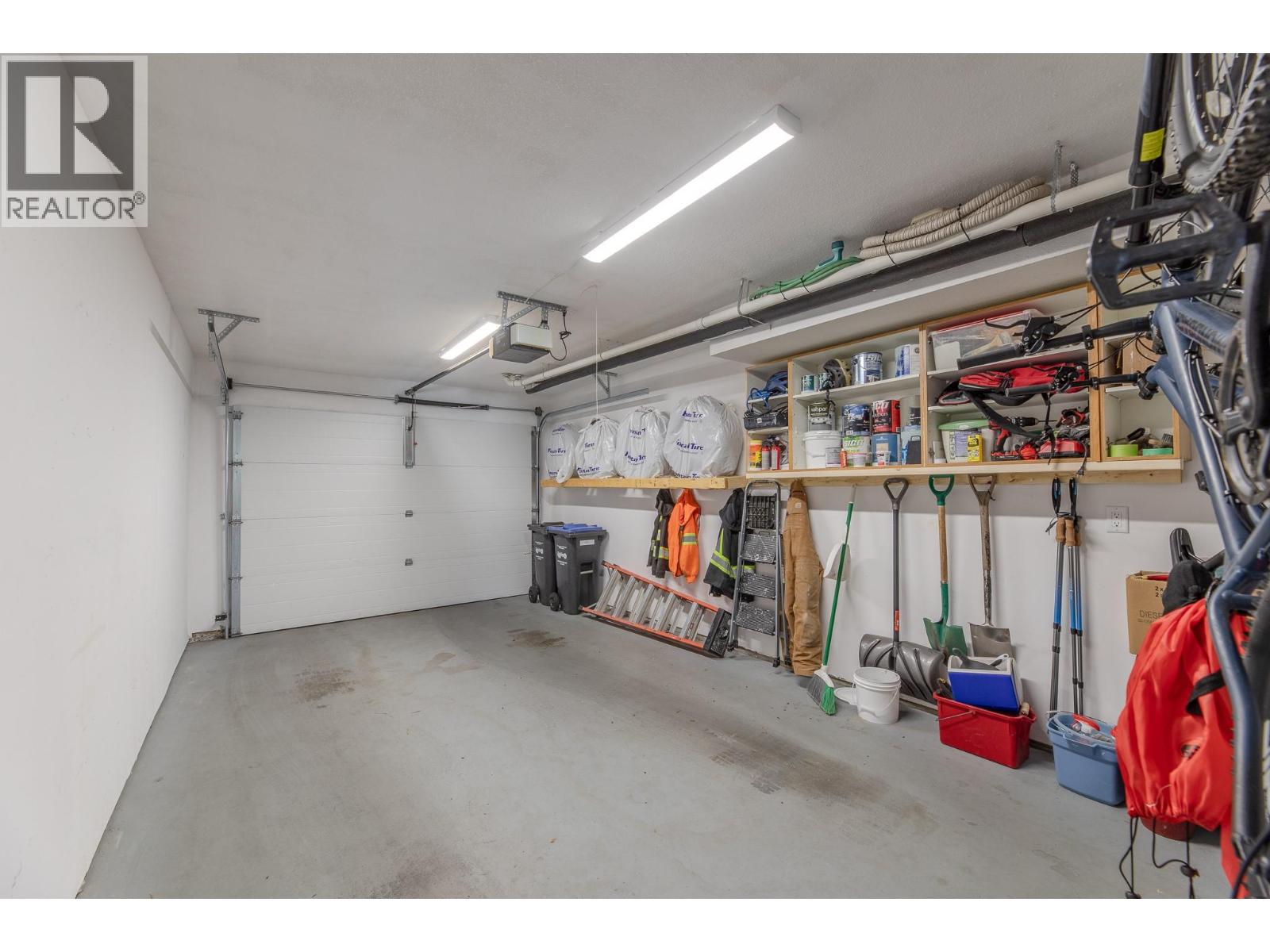 132 3948 Finnerty Road, Penticton — single garage and storage wall