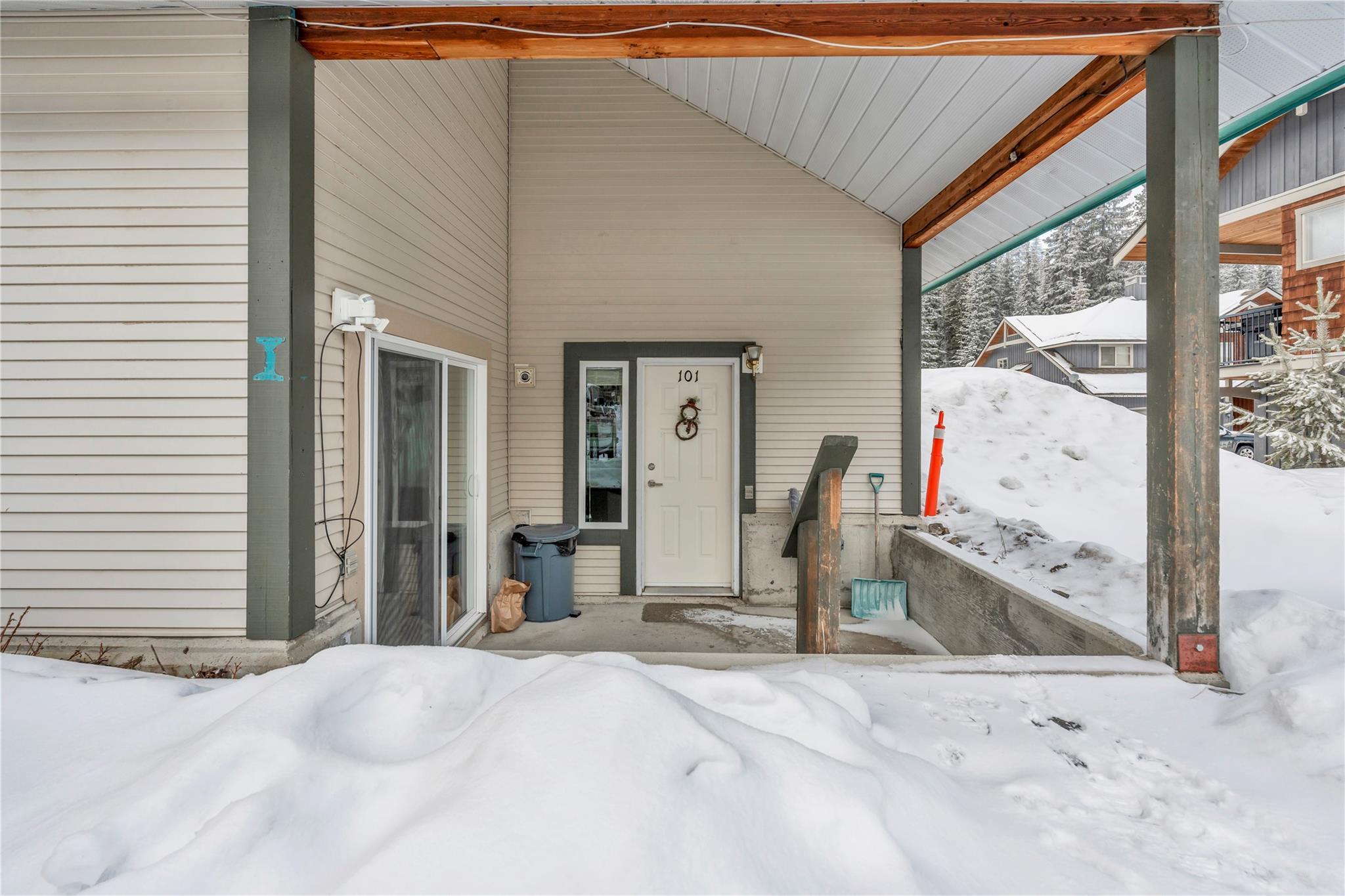 156 Clearview Crescent Unit 101 — covered entry and snowy patio