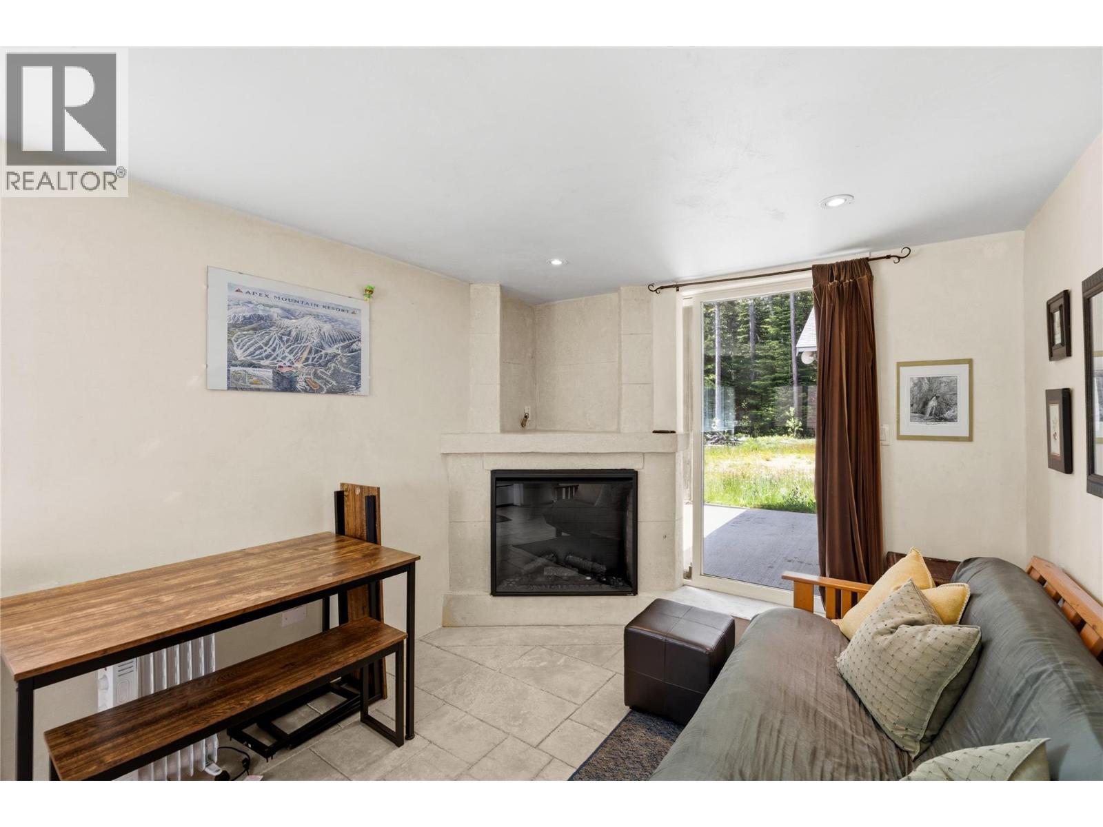 156 Clearview Road Unit 103A — living room with fireplace and patio access