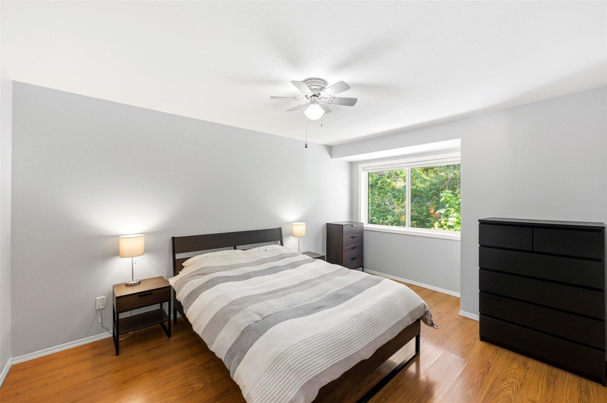 Primary bedroom in Unit 189 at 1458 Penticton Avenue in Penticton.