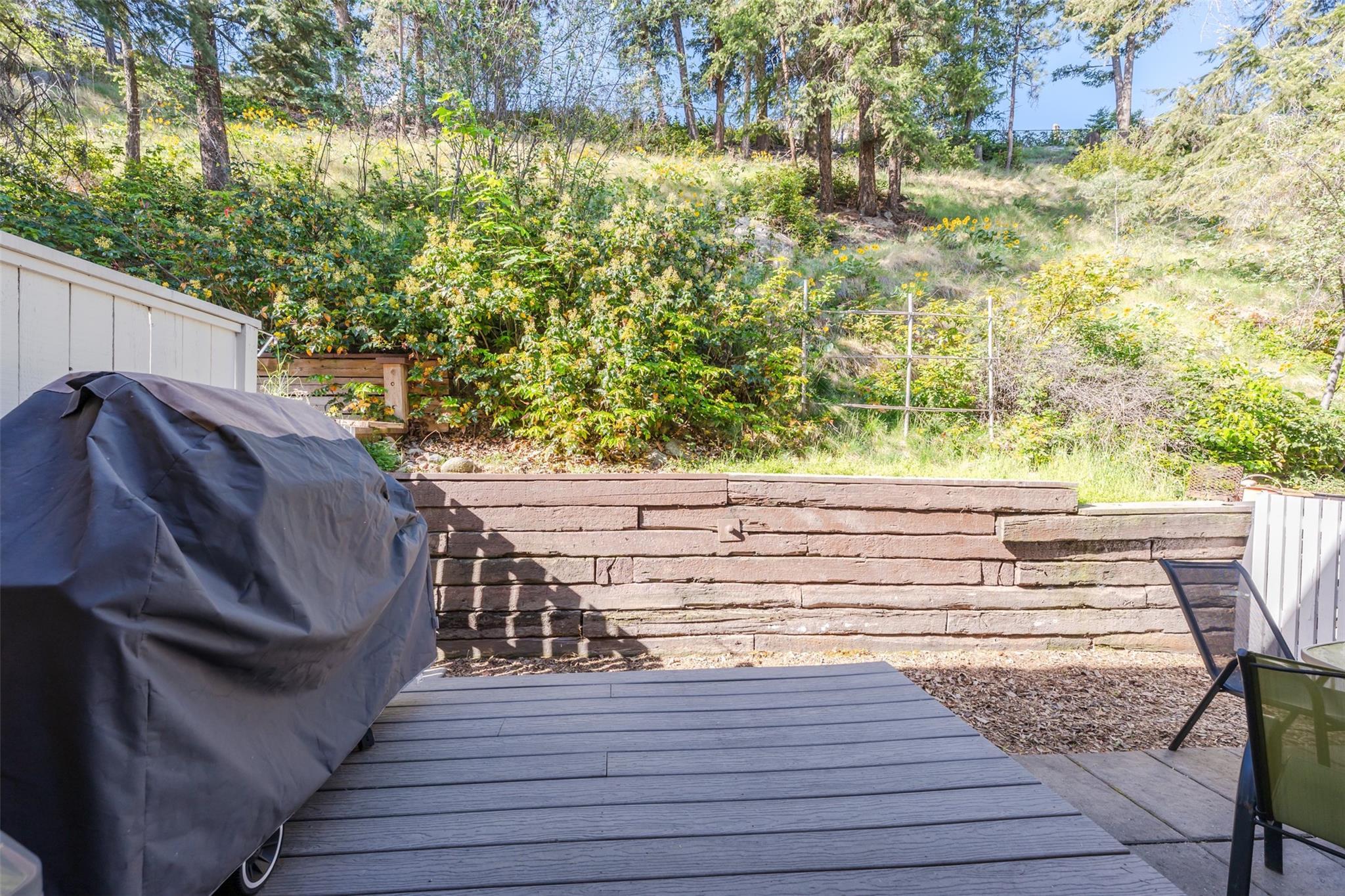 Private patio backing onto green space at Unit 189 in Cascade Gardens.