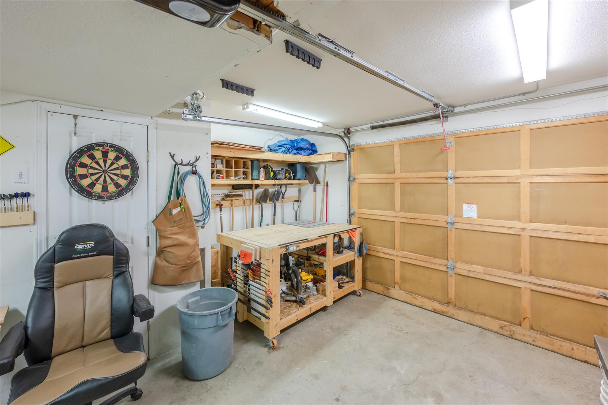 Attached garage and workshop area in Unit 189 at 1458 Penticton Avenue.