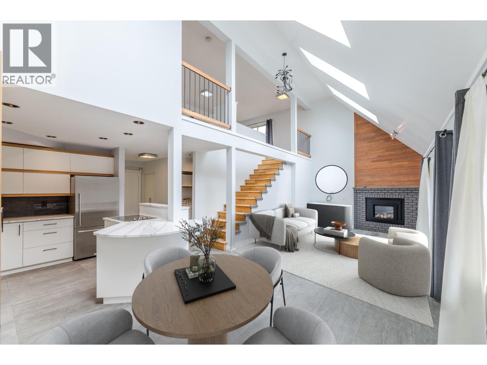 201 335 Churchill Avenue, Penticton — vaulted open living and dining room