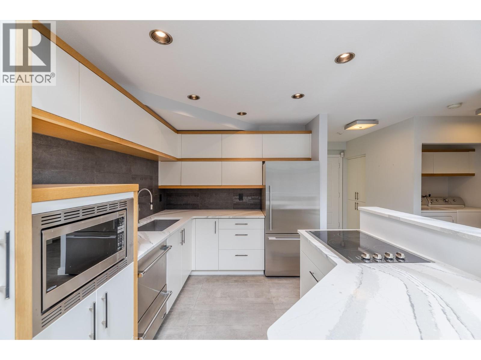 201 335 Churchill Avenue, Penticton — renovated kitchen with island
