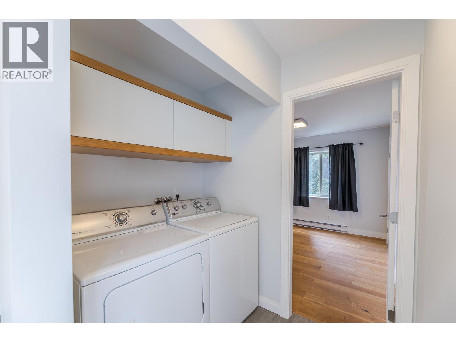 201 335 Churchill Avenue, Penticton — in-suite laundry area