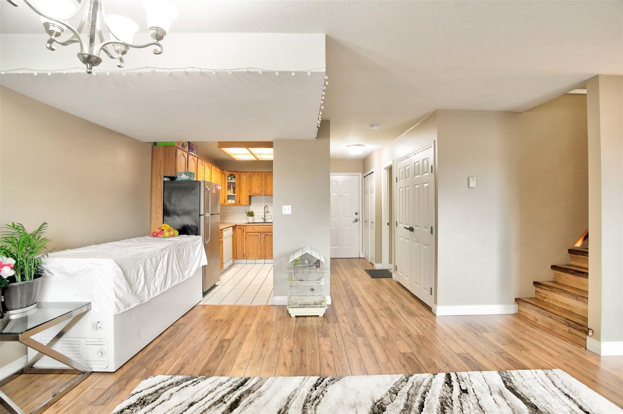Open dining and living layout in Unit 203 at Eckhardt Manor.