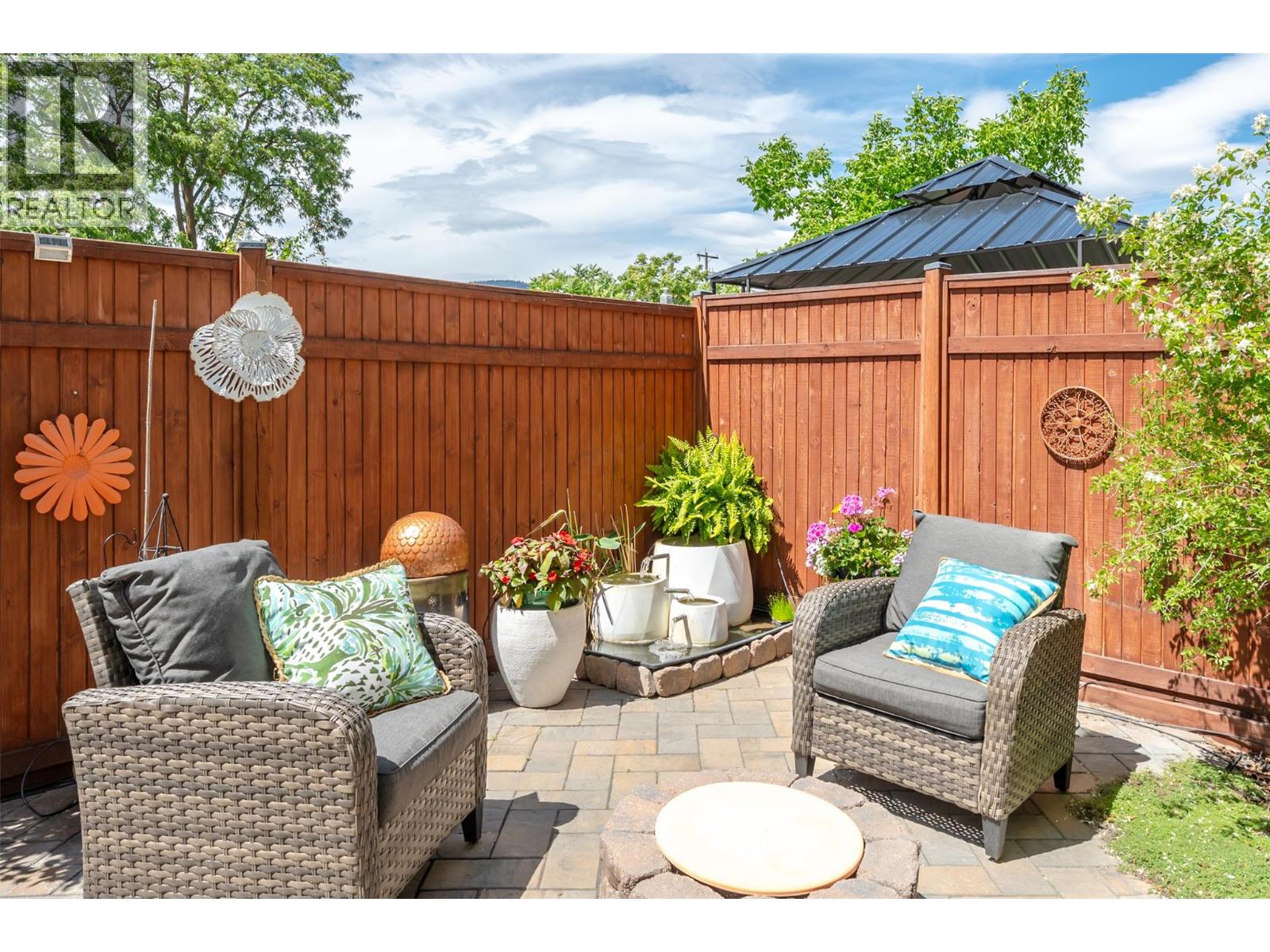 Unit 107 at 210 Scott Avenue, Penticton — landscaped private patio