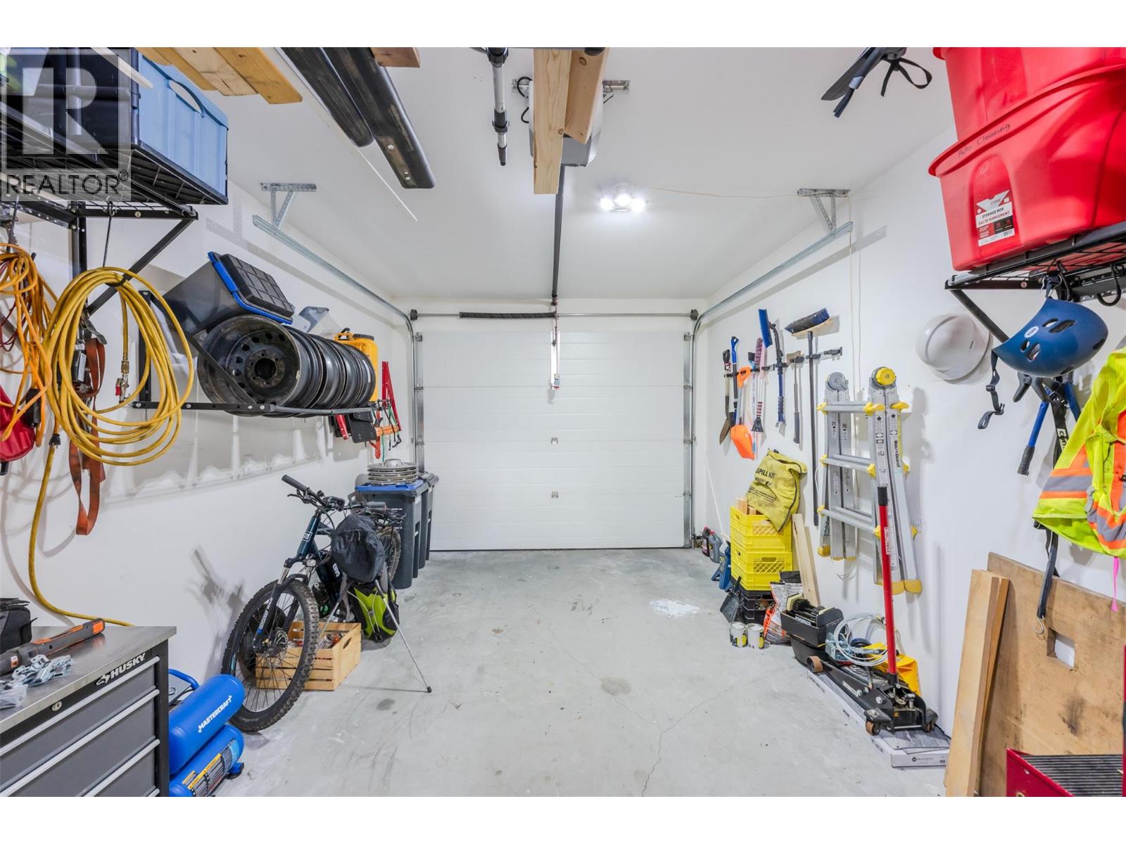Unit 107 at 210 Scott Avenue, Penticton — attached garage and storage
