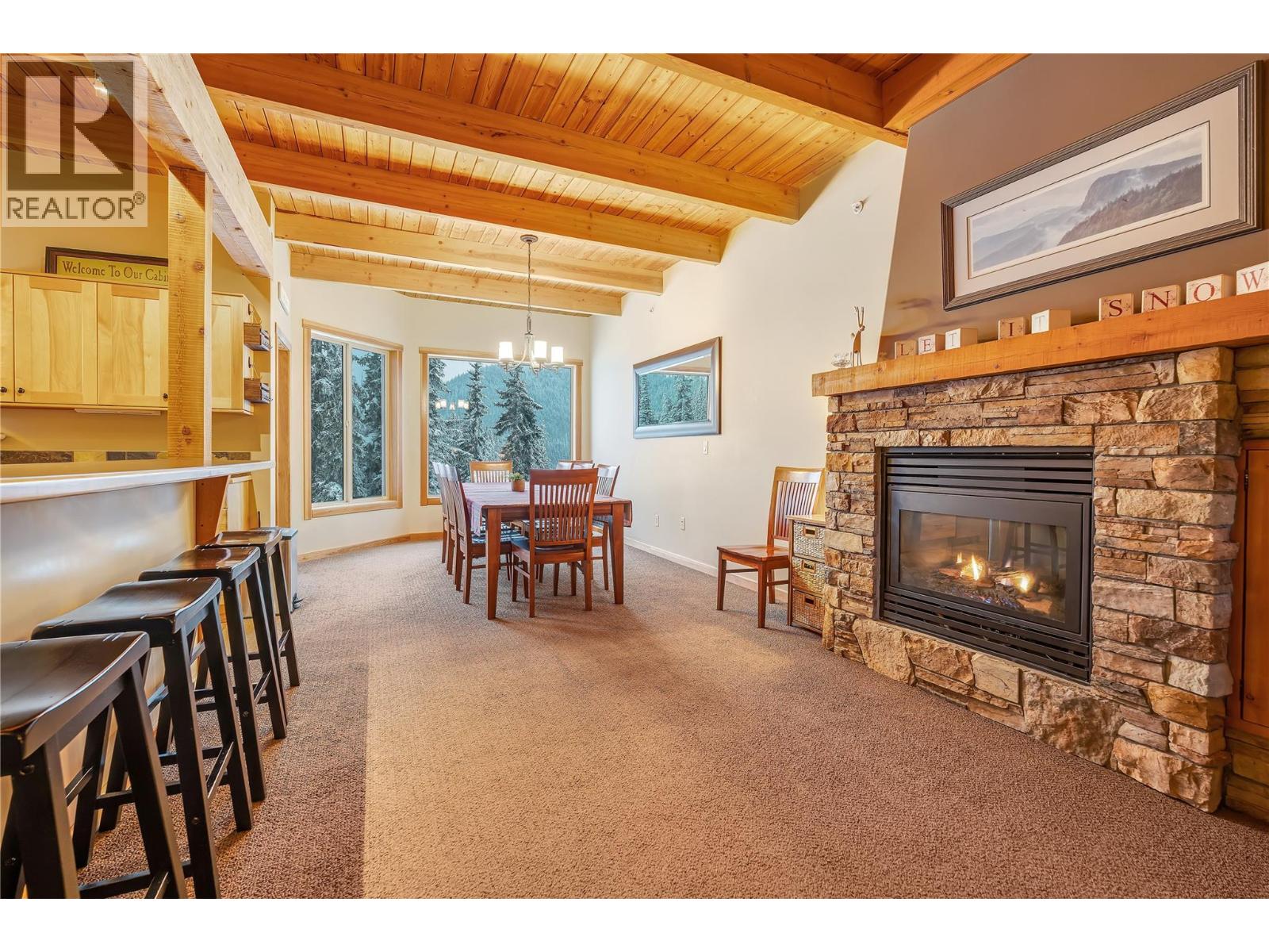 308 Creekview Road Unit 17 — open living area with stone fireplace