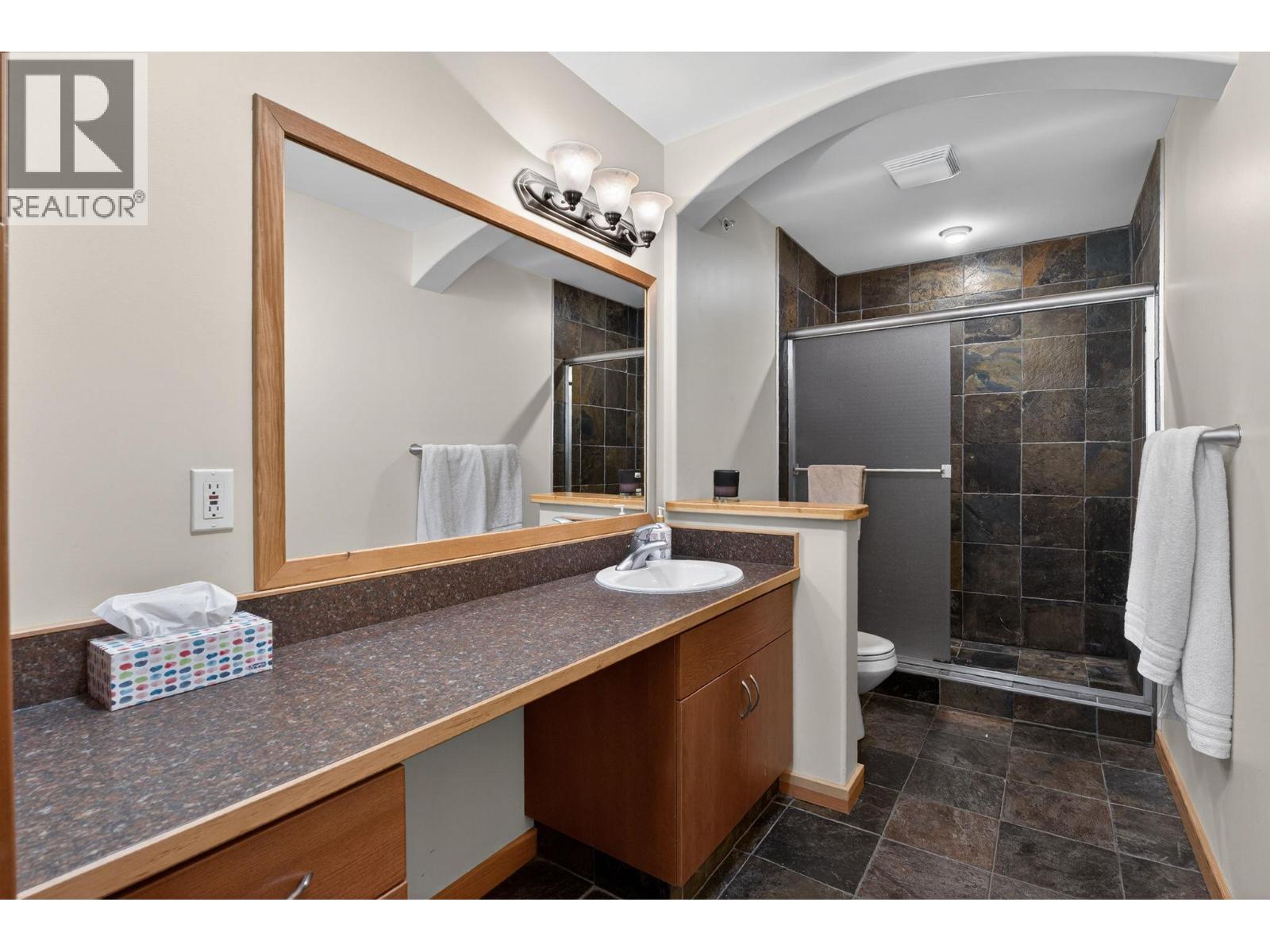 360 Strayhorse Road Unit 19 — bathroom with tiled shower