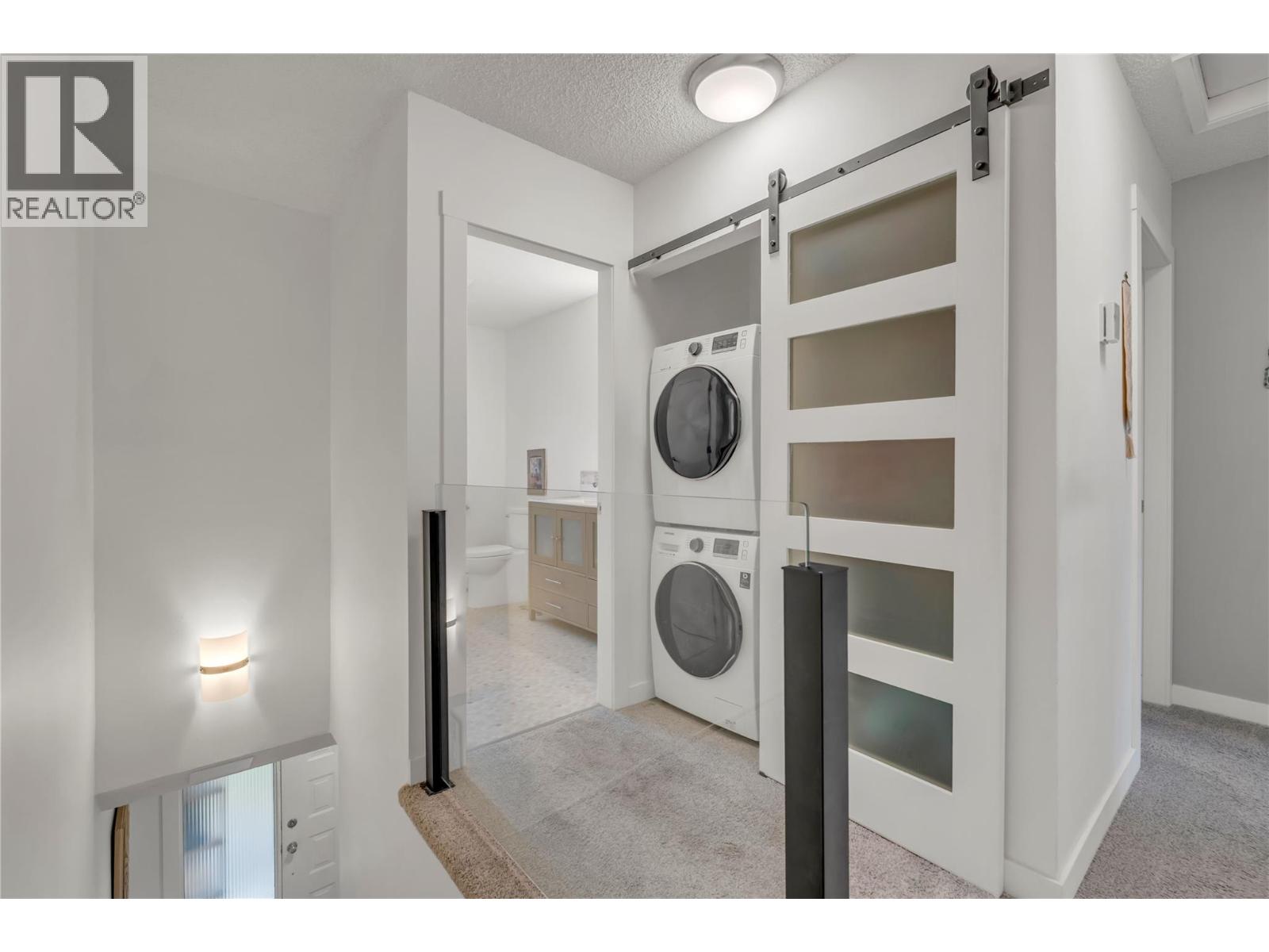 Unit 13 at Skaha Village, 310 Yorkton Avenue, Penticton — upper laundry and storage