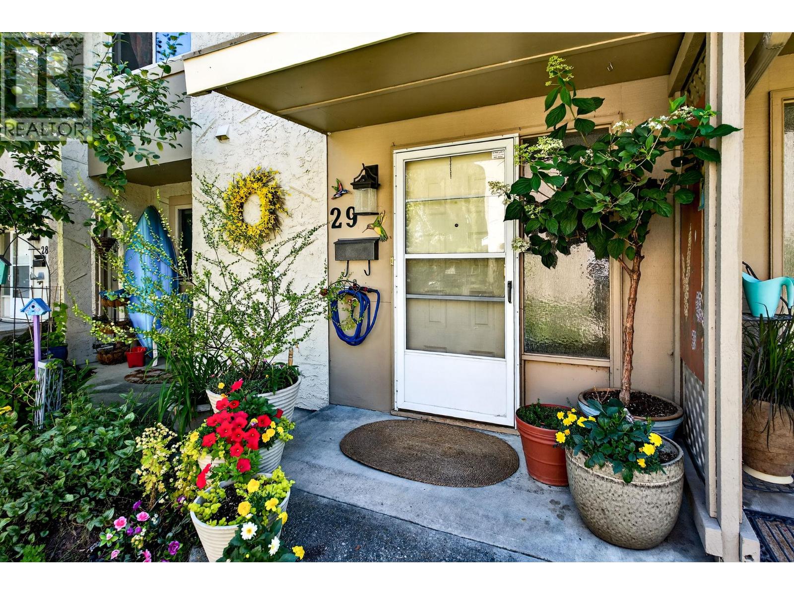 Unit 29 at Skaha Village, 310 Yorkton Avenue, Penticton — private front entrance and garden