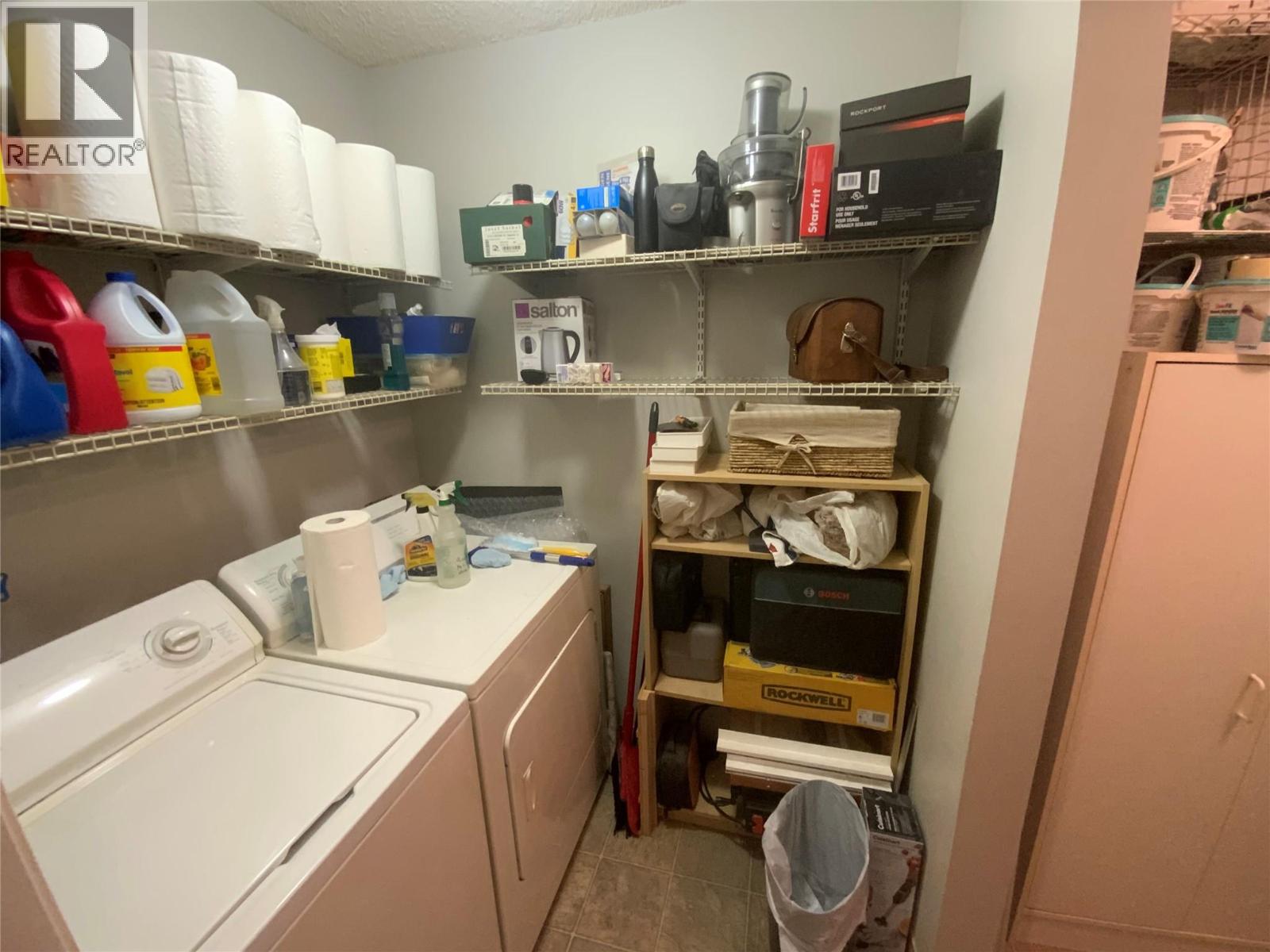 Unit 216 at Tiffany Gardens, 3140 Wilson Street, Penticton — laundry and storage area